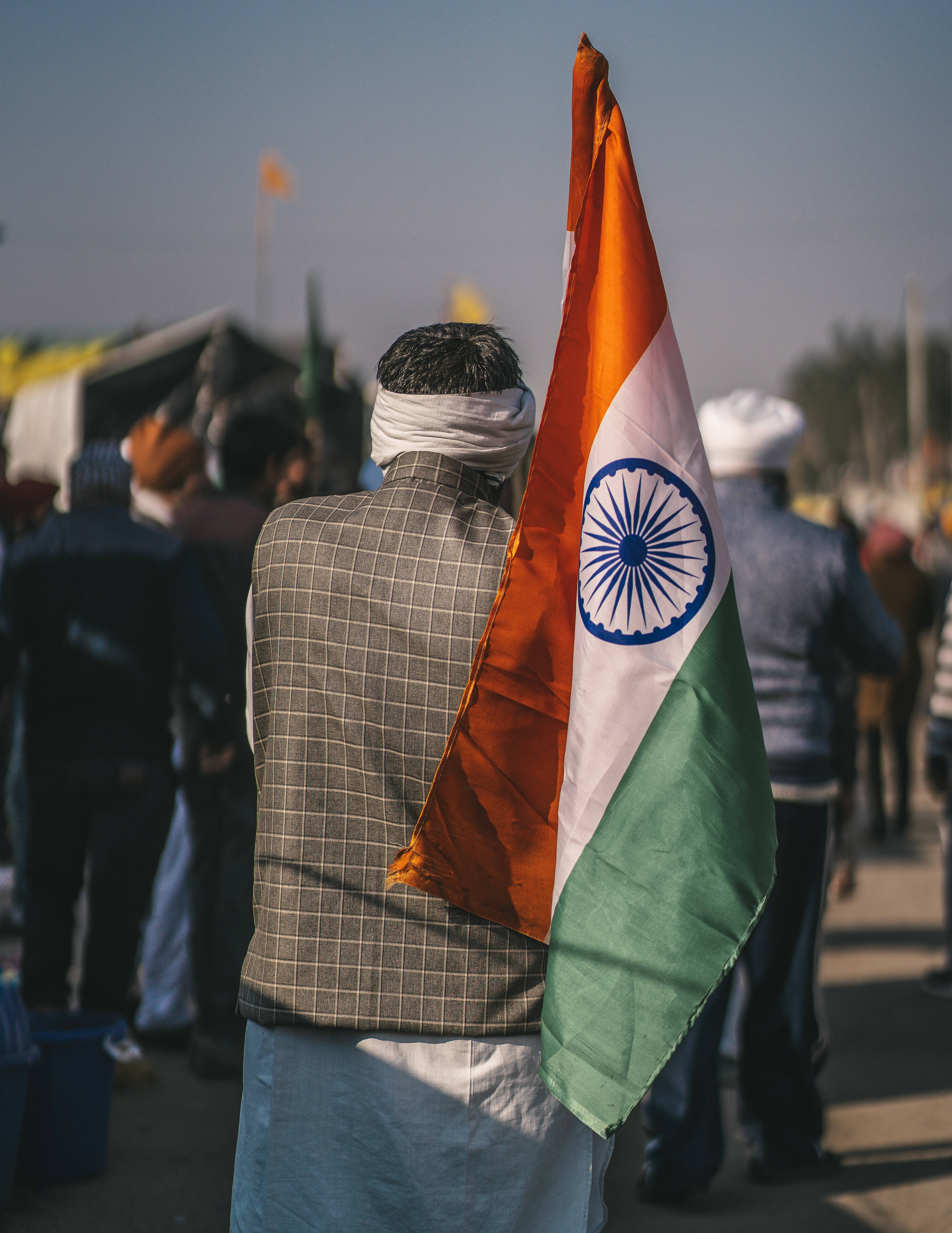 Indian Flag, patriotic man, crowded outdoor gathering, 4K Phone Wallpaper