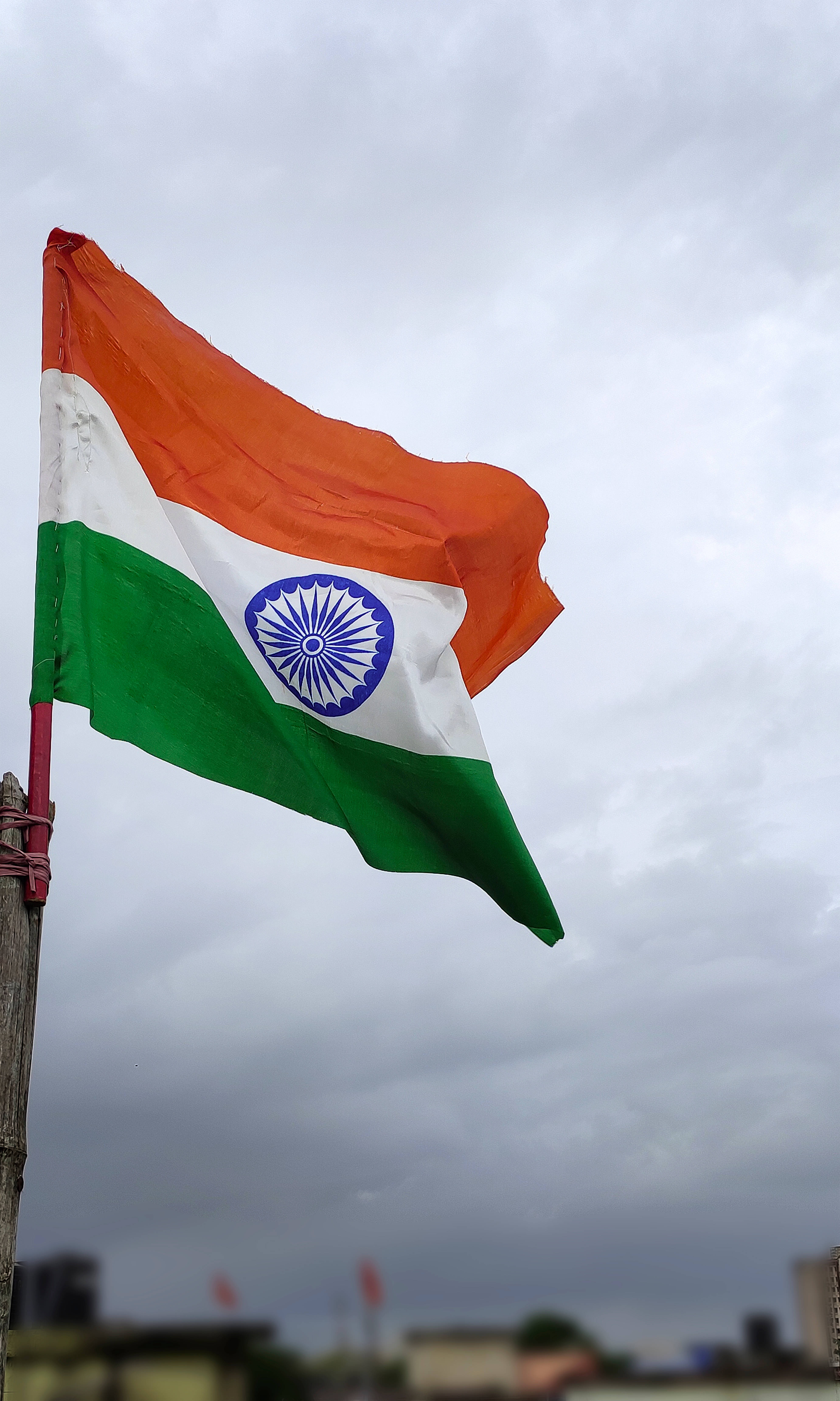 Indian Flag, cloudy sky, urban buildings, 5K Phone Wallpaper