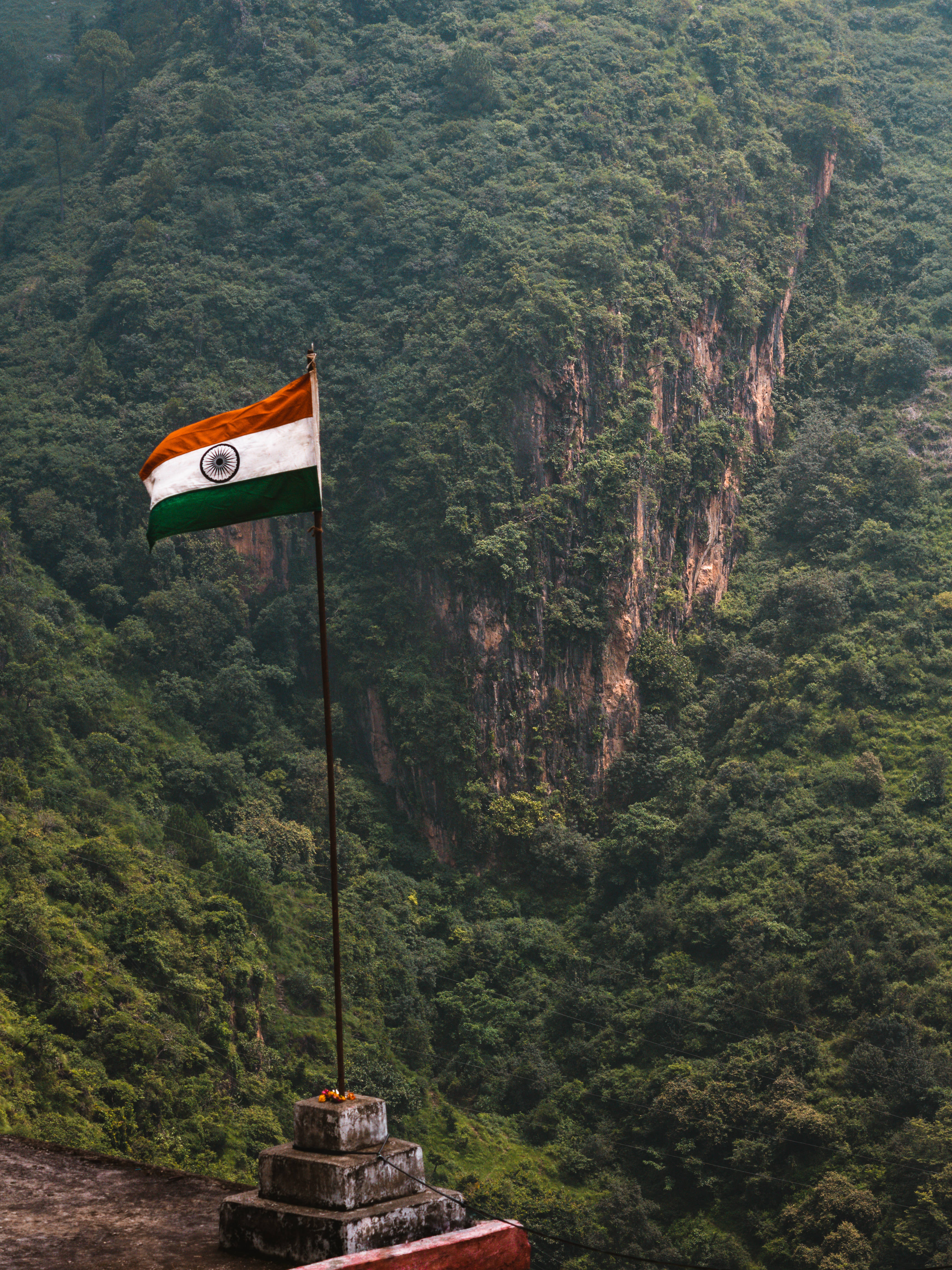 Indian Flag, stone pedestal, lush green forested mountains, 4K Phone Wallpaper