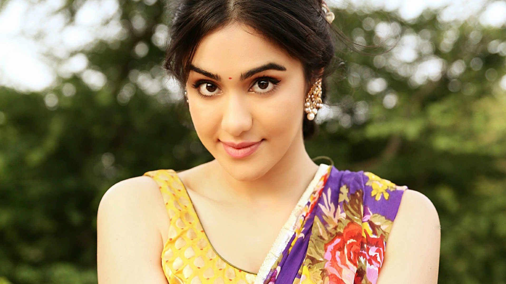 Indian Girl, vibrant yellow and purple floral sari, soft smile, Full HD Desktop Wallpaper