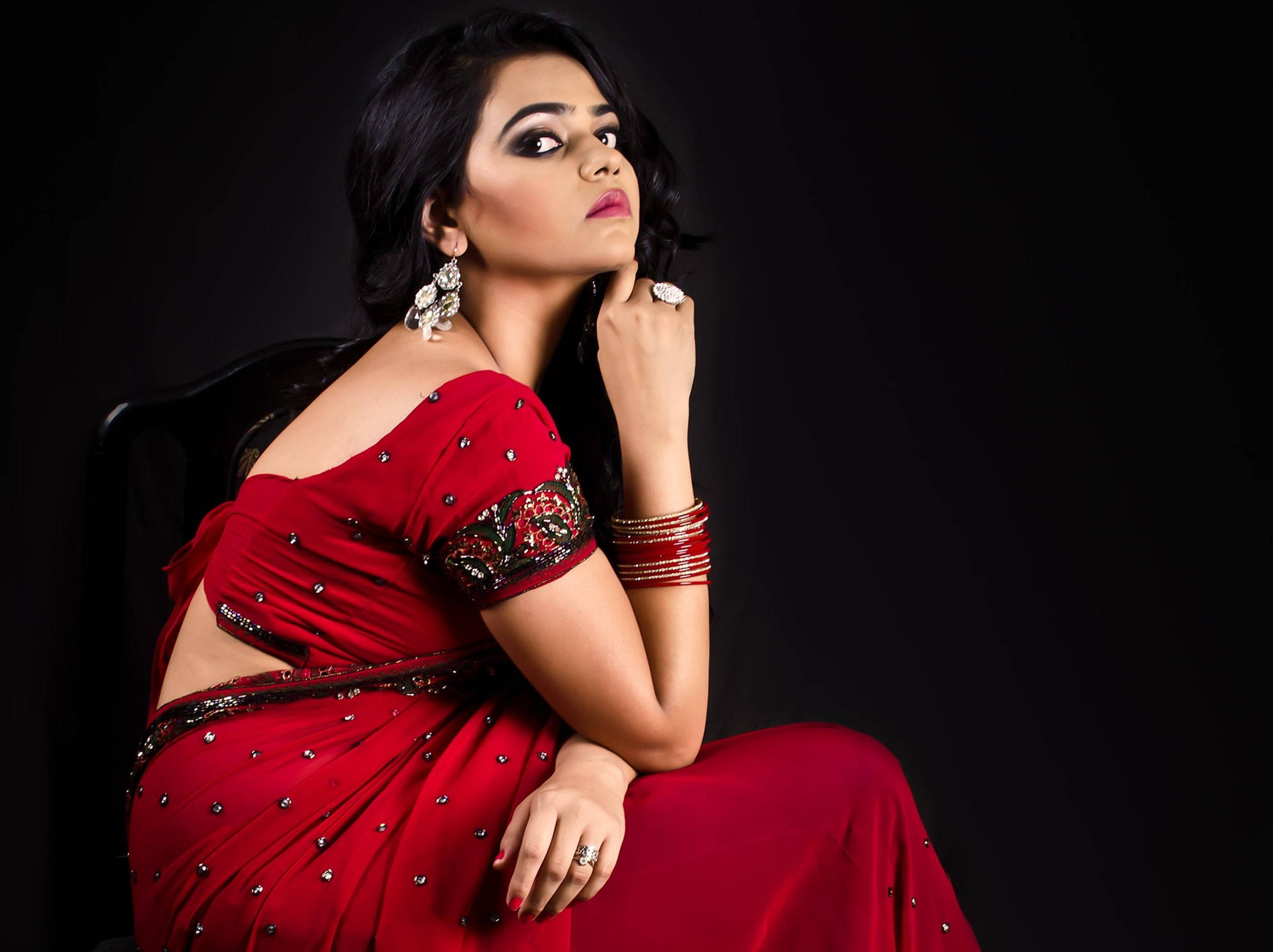 Indian Girl, vibrant red embellished sari, stark black background, Full HD Desktop Wallpaper