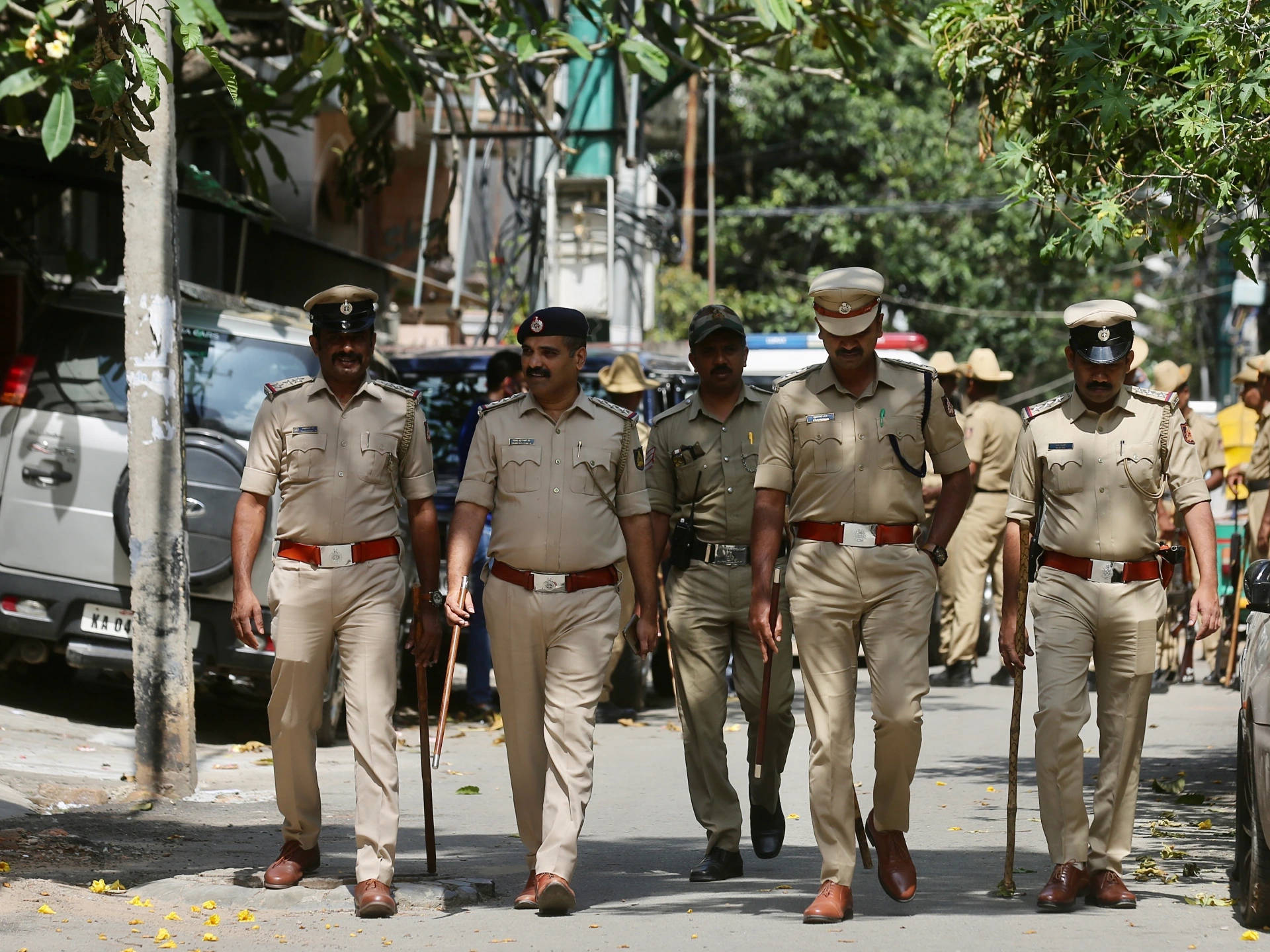 Indian Police, khaki uniforms, tree-lined urban street, Full HD Desktop Wallpaper