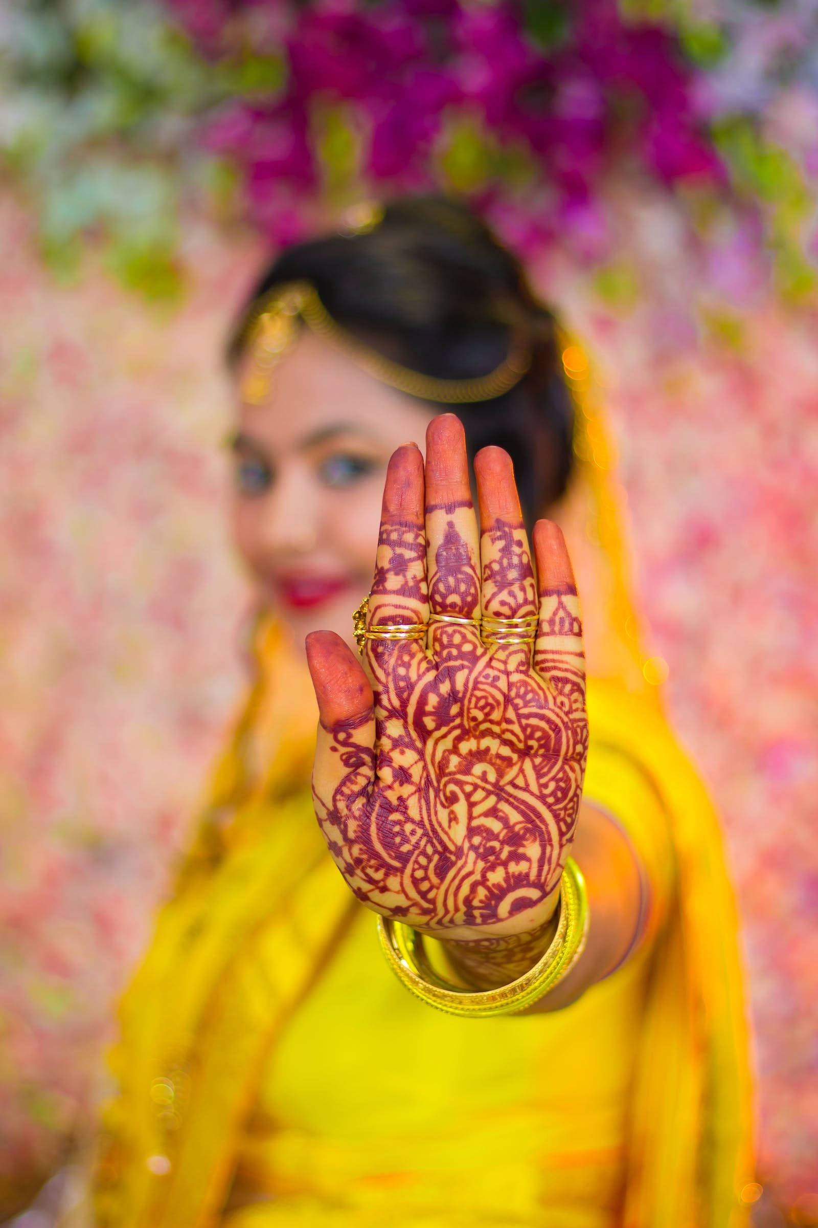 woman, vibrant yellow attire, intricately hennaed hand, Full HD Phone Wallpaper