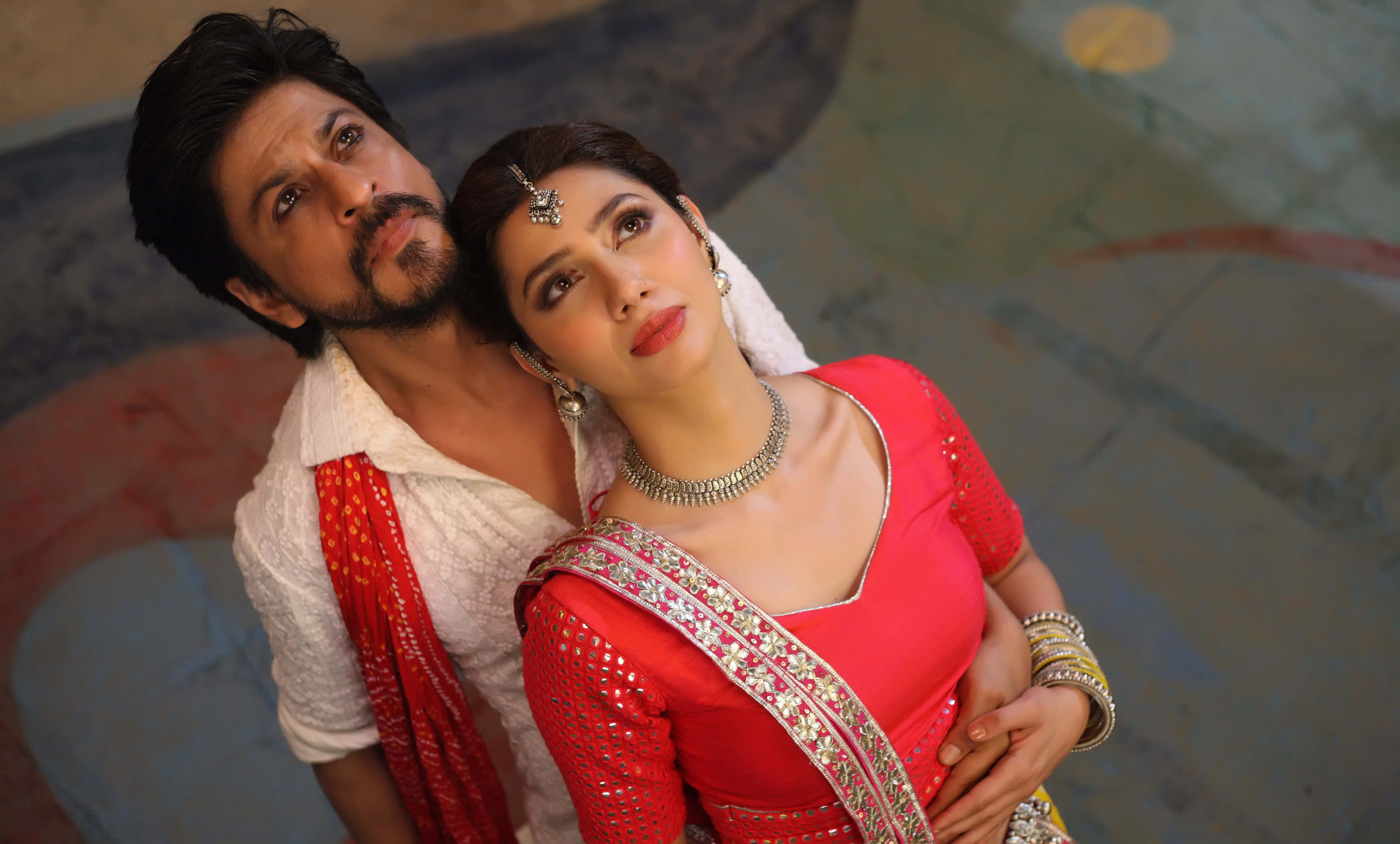 Bollywood couple, traditional Indian attire, elegant pose, 5K Desktop Wallpaper