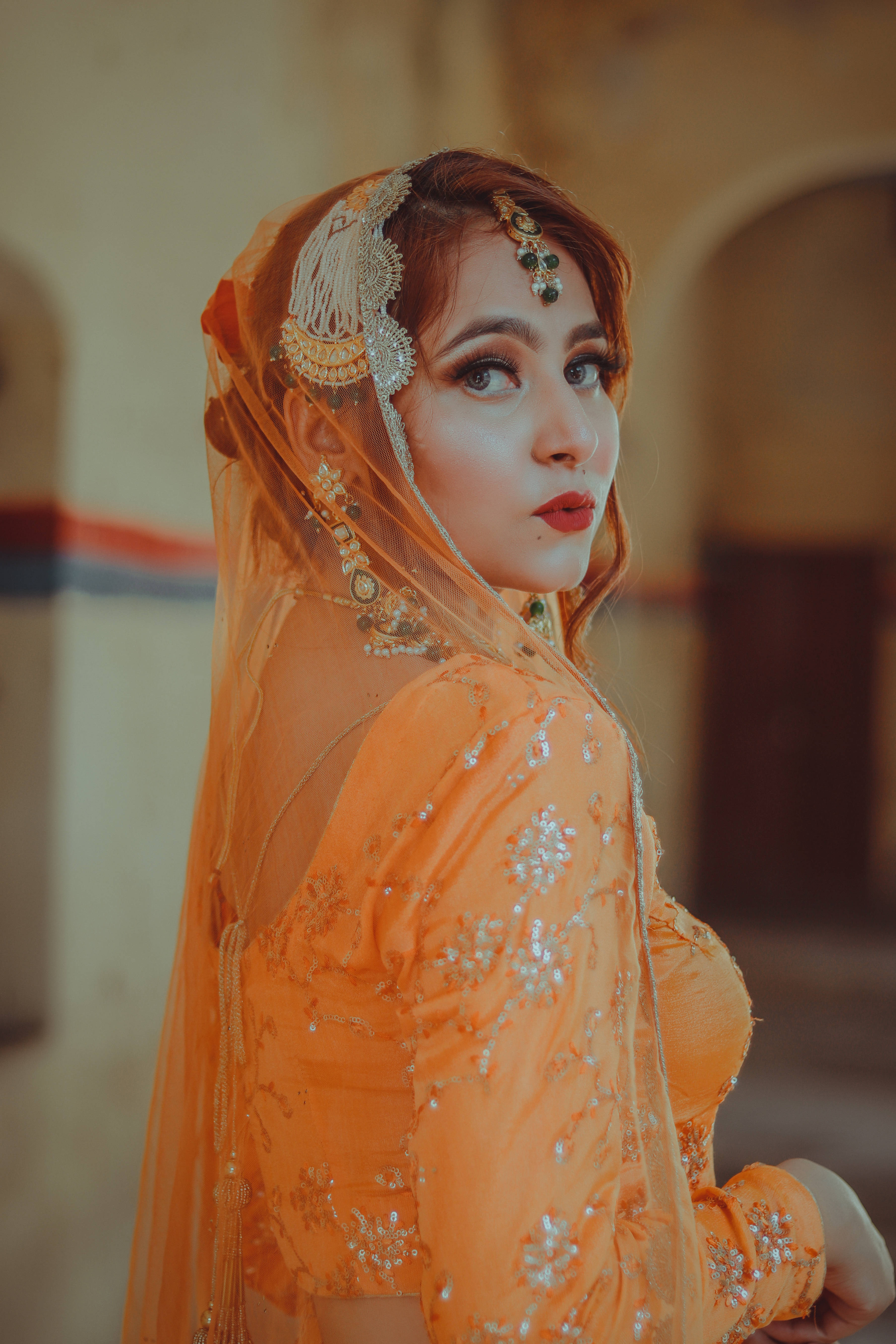 Indian aesthetic, veiled woman, ornate orange traditional attire, 5K Phone Wallpaper