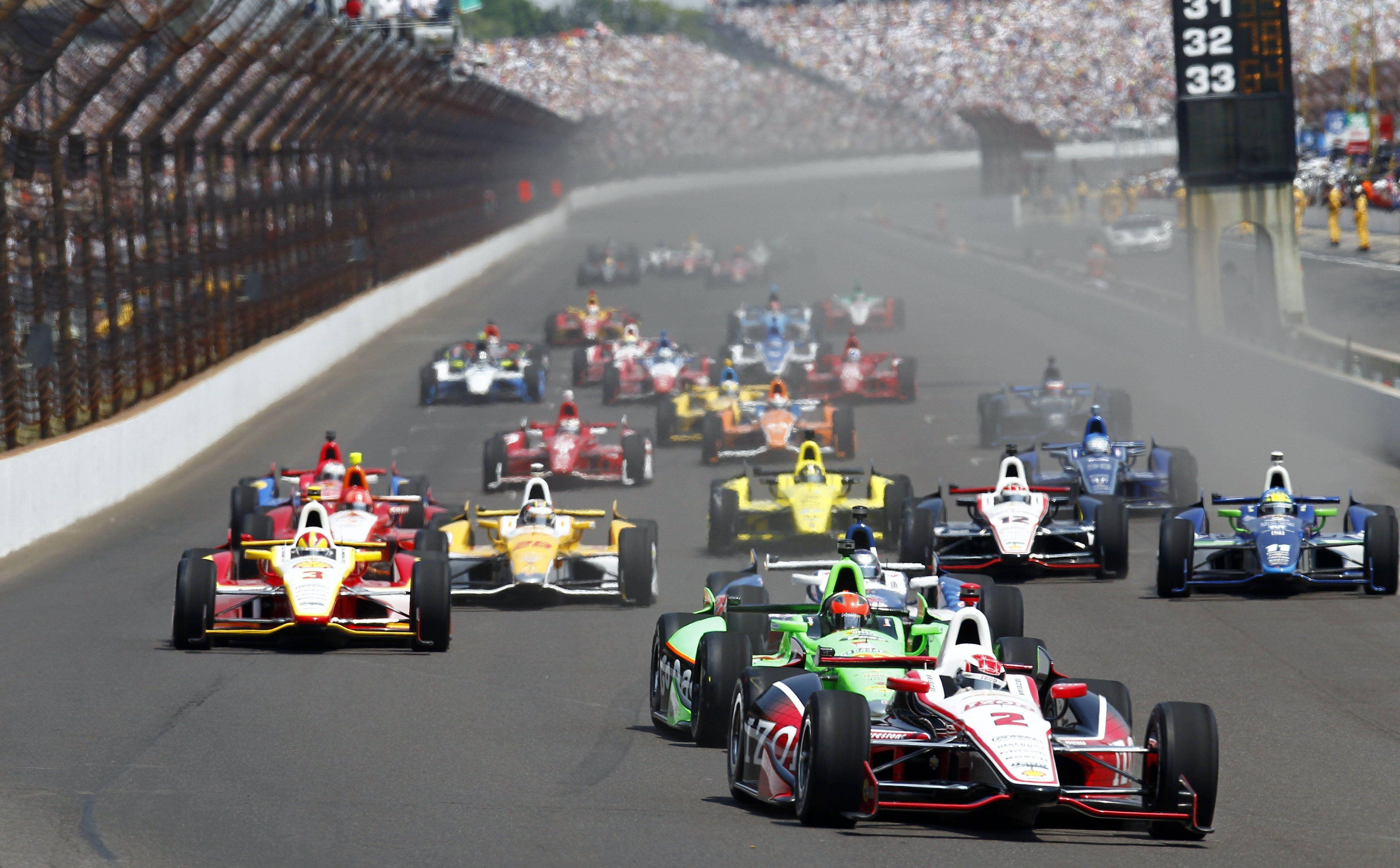 Indianapolis 500, open-wheel race cars, sunlit racetrack, 4K Desktop Wallpaper