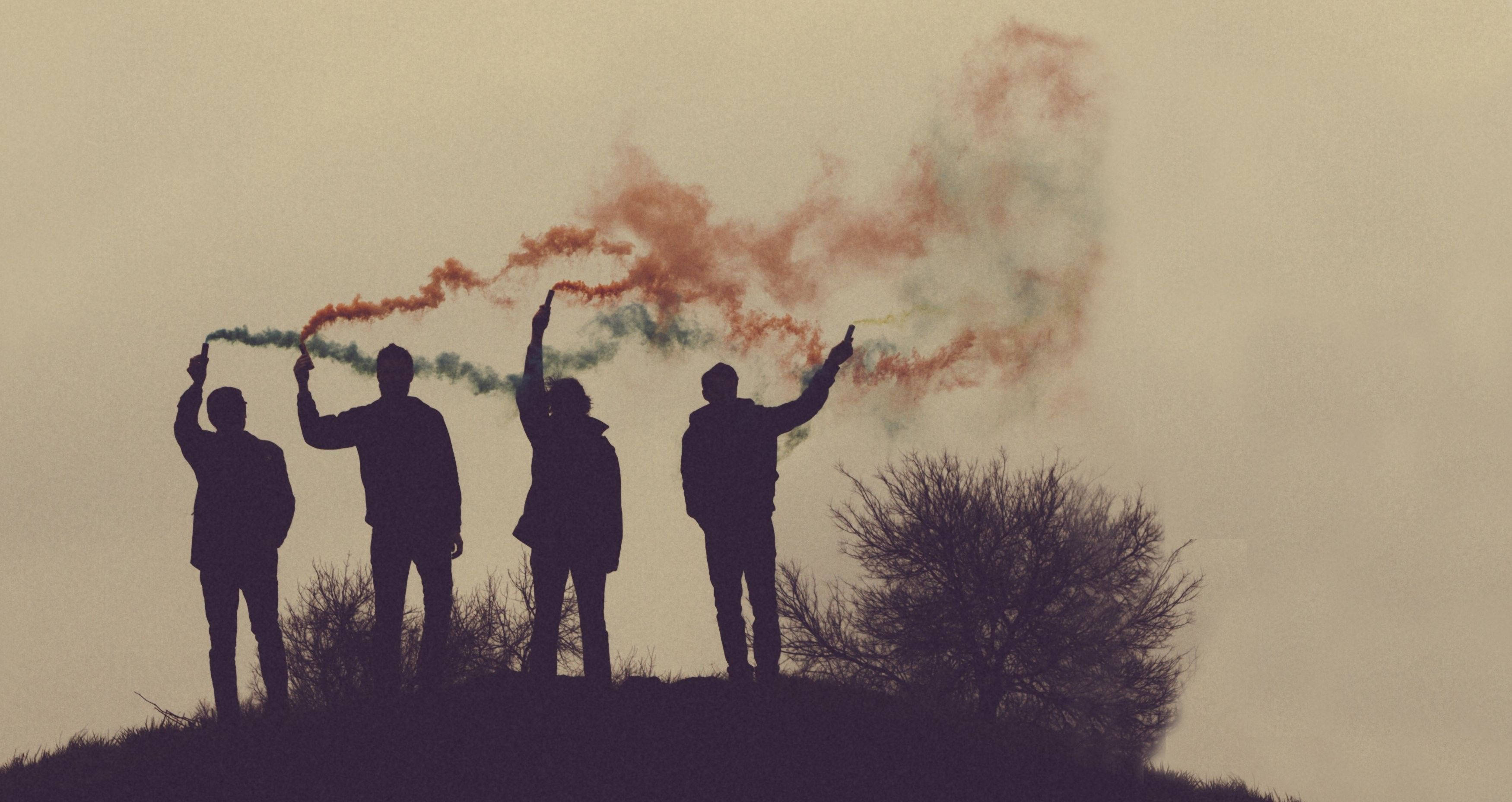 Indie Aesthetic Laptop, color sprays, silhouetted figures, 2K Desktop Wallpaper