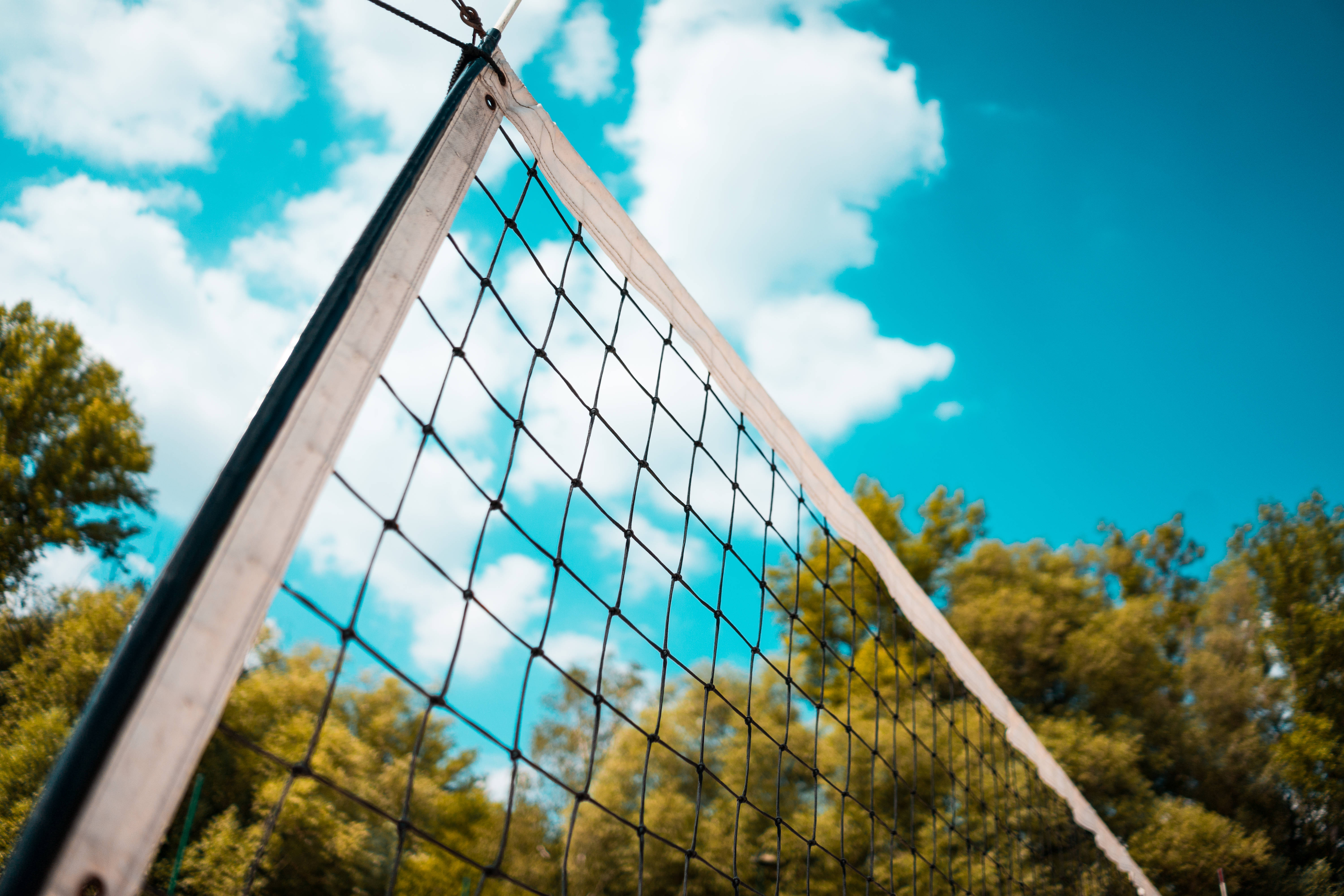 volleyball net, vibrant blue sky, fluffy white clouds, 5K Desktop Wallpaper
