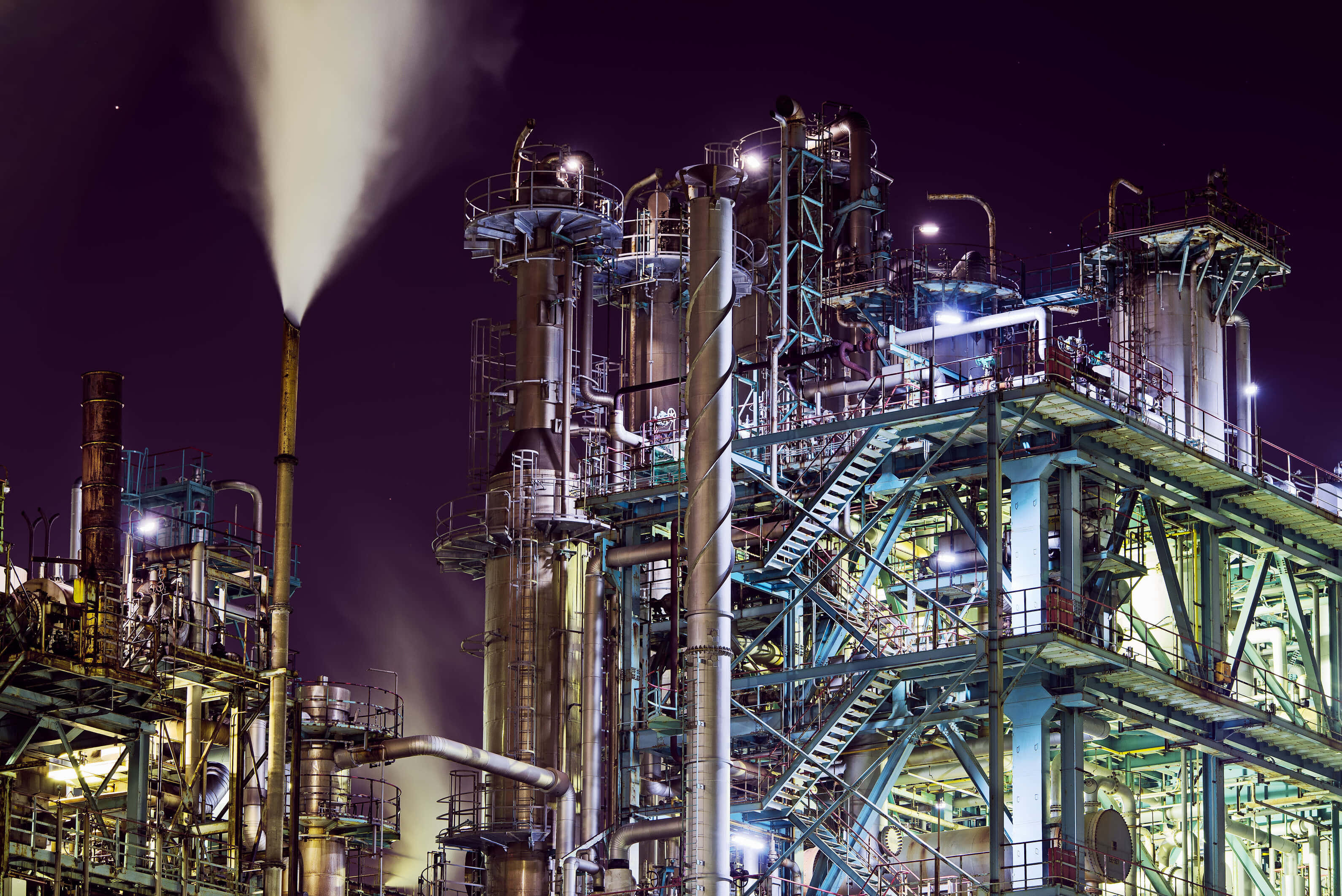 industrial refinery, glowing lights, steam, 2K Desktop Wallpaper