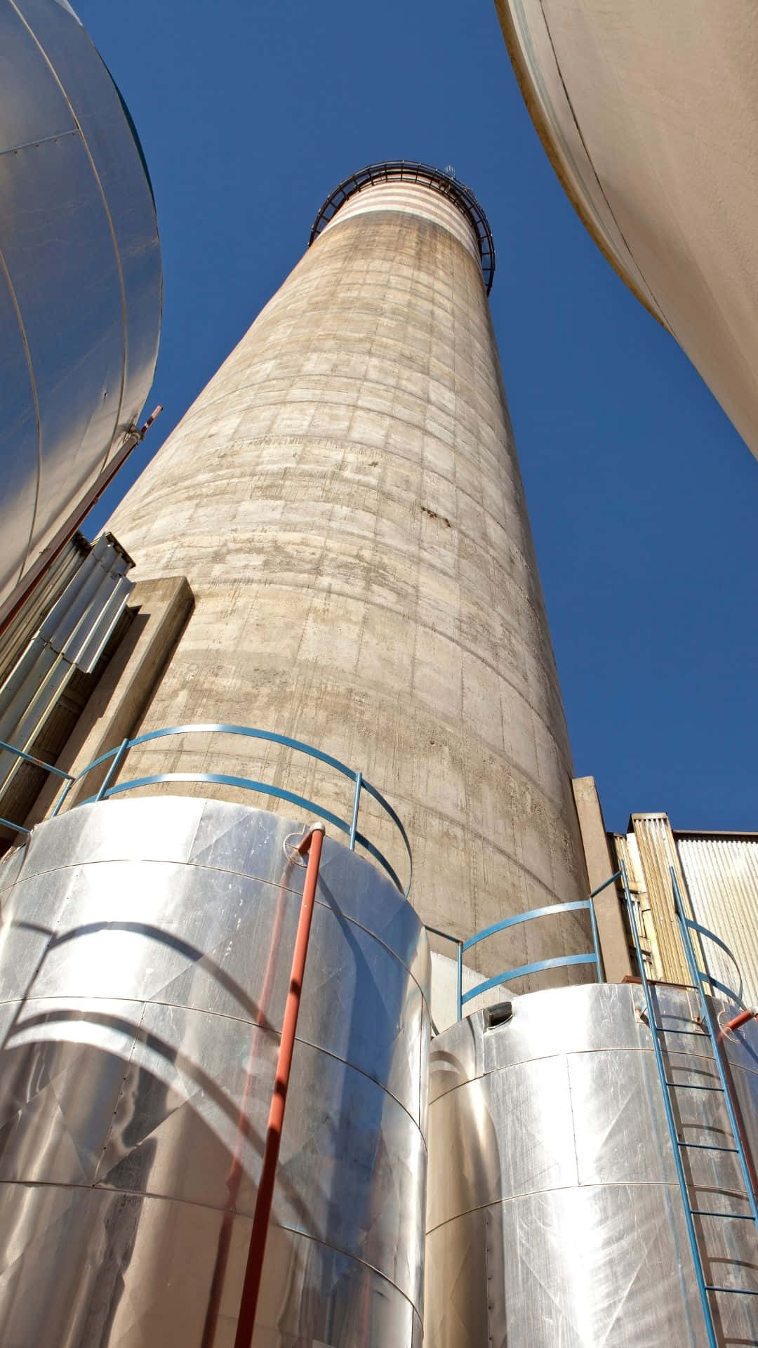 concrete chimney, shiny metal tanks, clear blue sky, Full HD Phone Wallpaper