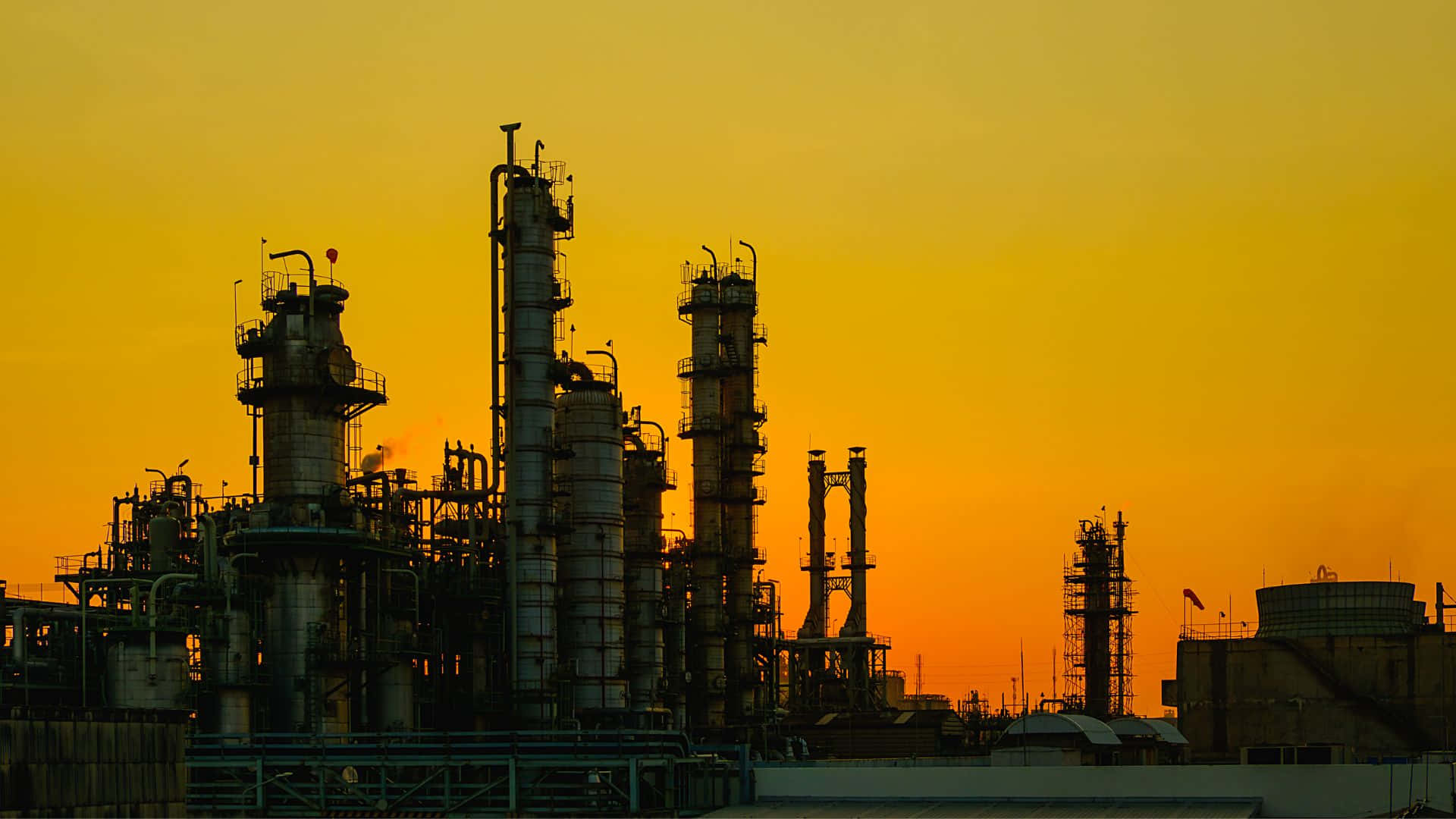 industrial refinery towers, fiery orange and yellow sunset sky, silhouetted, Full HD Desktop Wallpaper