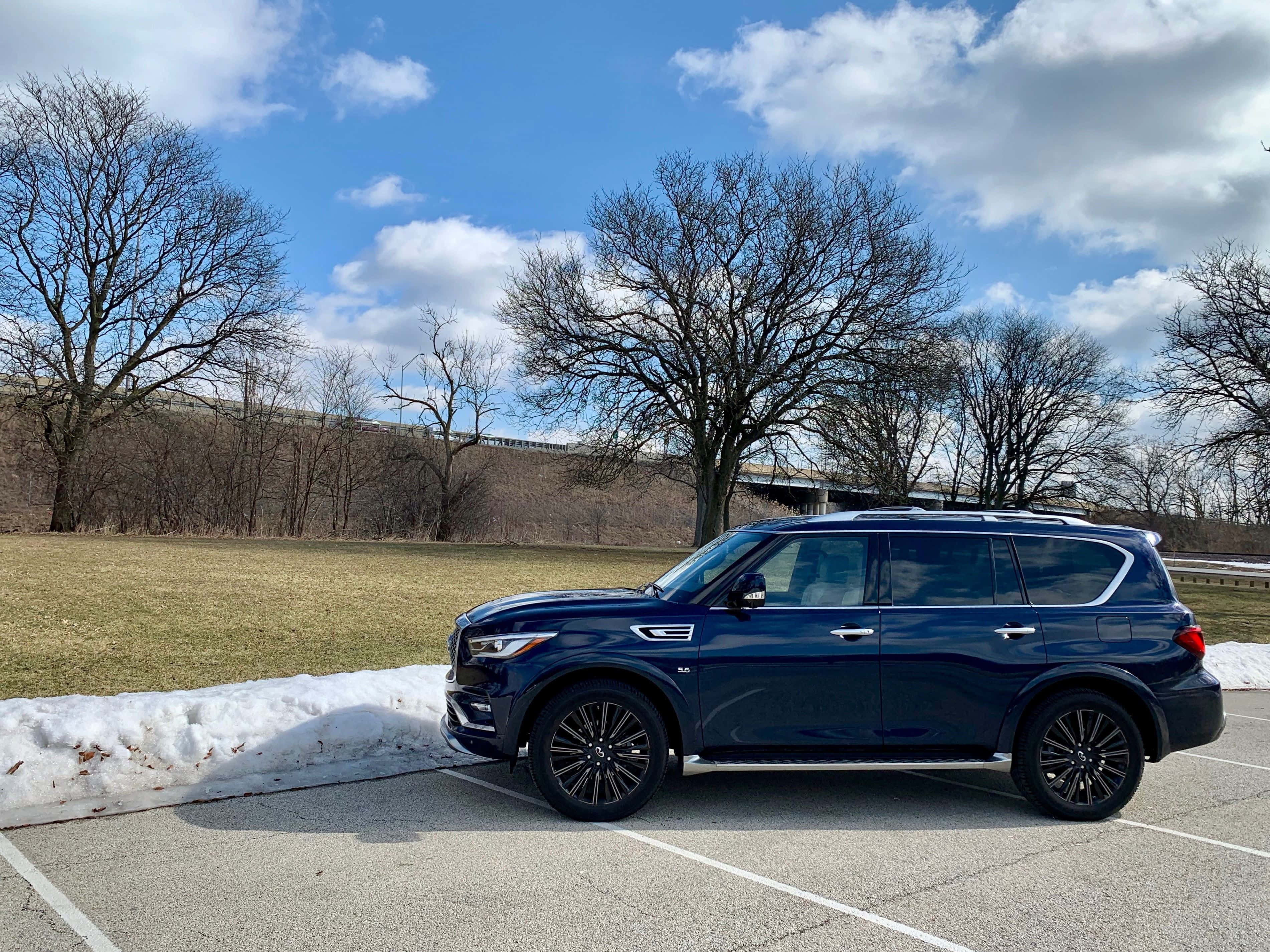 Infiniti QX80, blue SUV, snowy lot, 2K Desktop Wallpaper