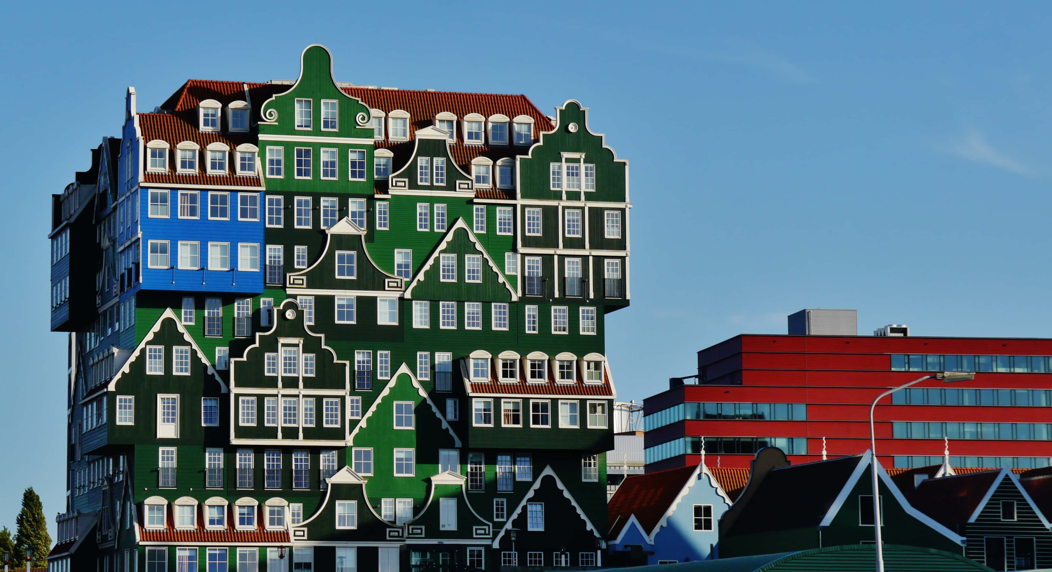 Inntel Hotel Zaandam, red building, colorful traditional Dutch gabled facades, 2K Desktop Wallpaper