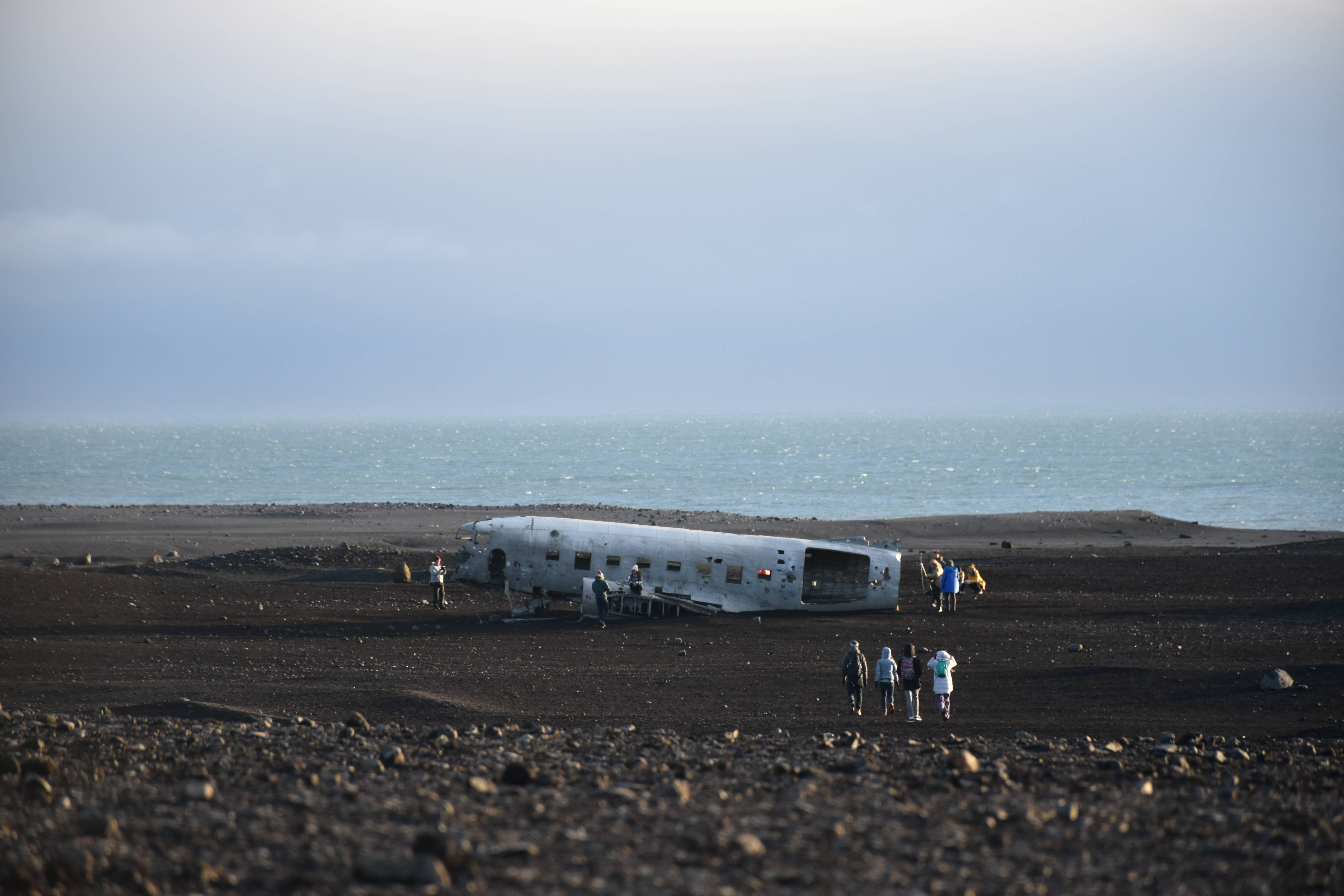 wrecked plane, black volcanic beach, airplane fuselage, 5K Desktop Wallpaper