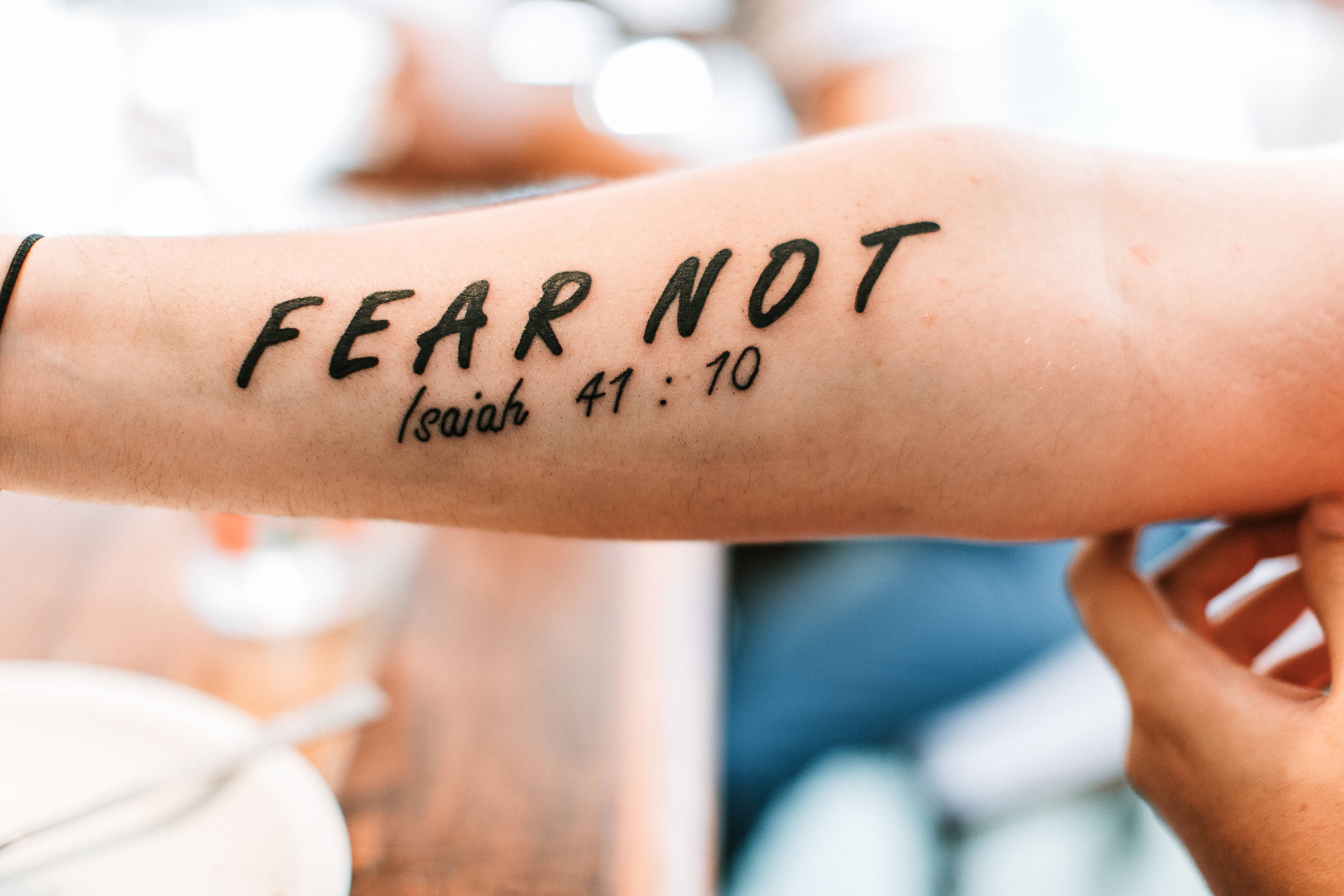 FEAR NOT Isaiah 41:10, bold black script, soft blurred background, 4K Desktop Wallpaper