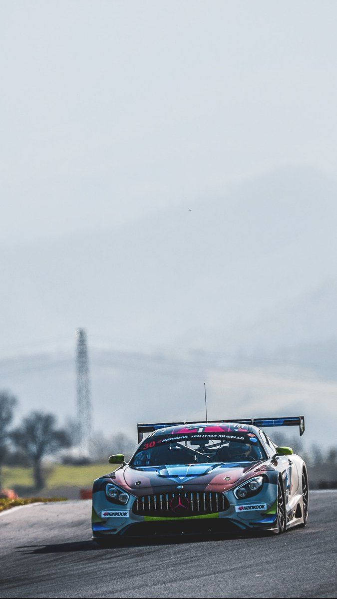 racing car, colorful livery, wet racetrack, SD Phone Wallpaper