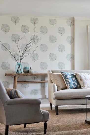 Jovial Wall Design, tree-patterned wallpaper, beige sofa, SD Phone Wallpaper