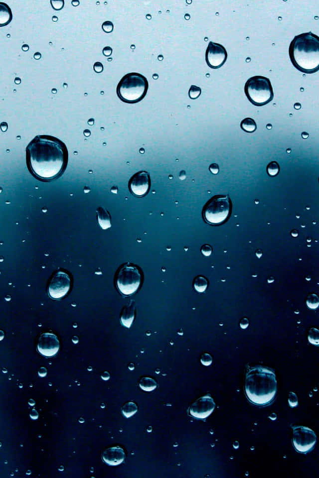iOS 4, moody blue gradient sky, raindrops, SD Phone Wallpaper