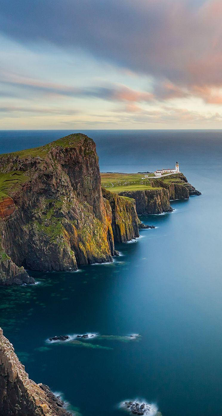 iOS 8, lighthouse, green cliffs, HD Phone Wallpaper