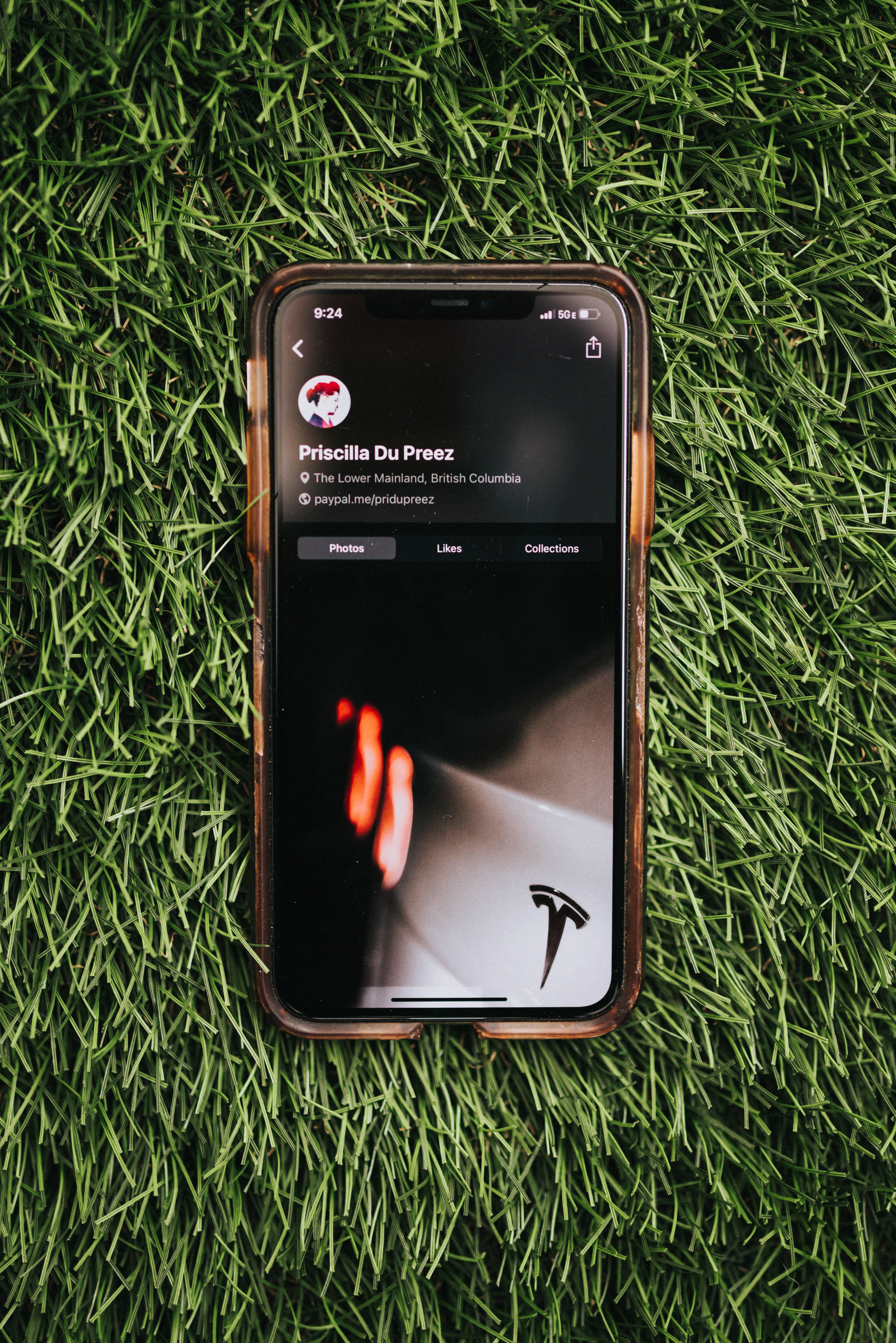 abstract tesla logo, ios phone, vibrant green grass, 5K Phone Wallpaper