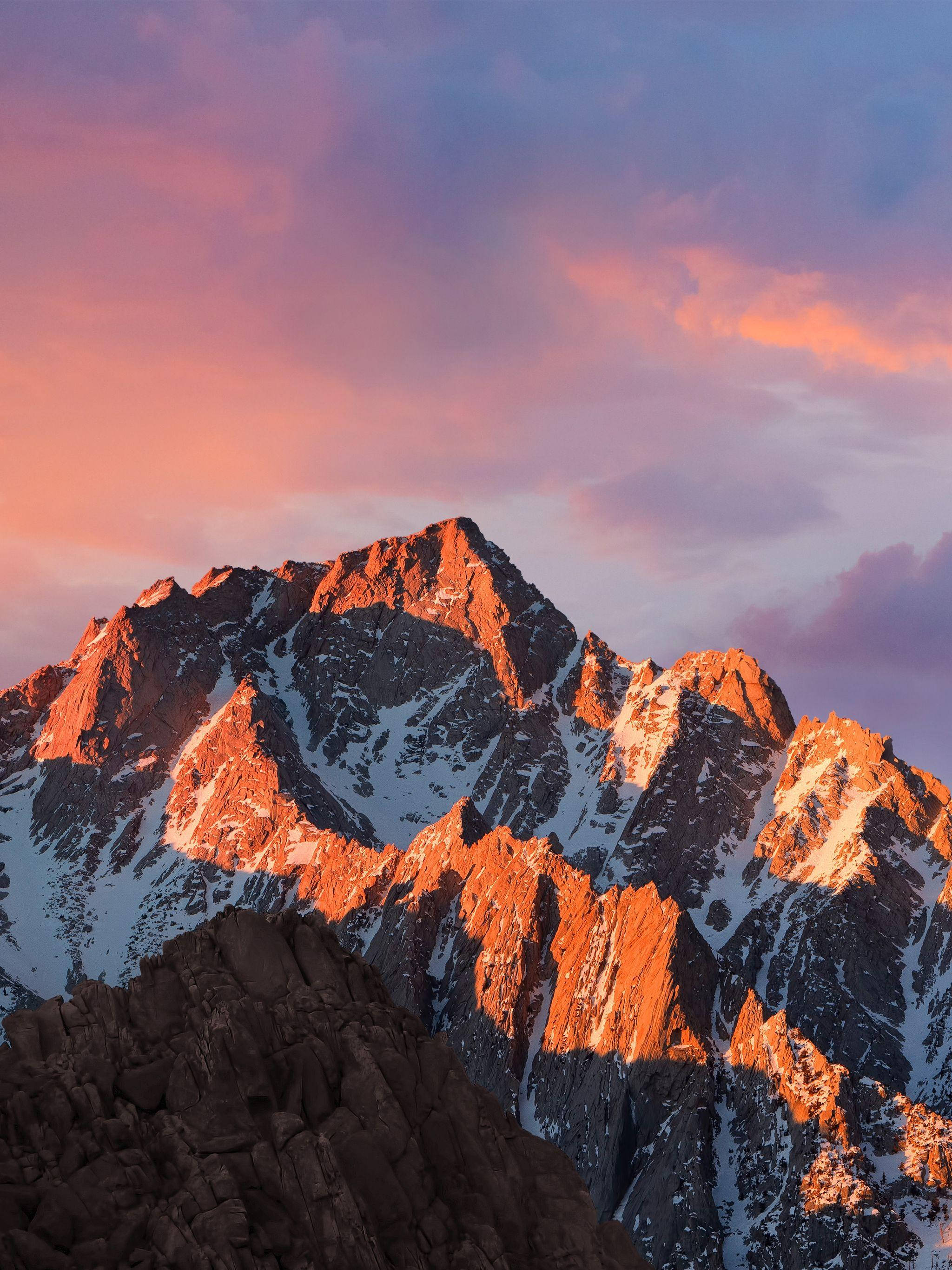 iPad Pro, snowcapped mountain peak, golden light, 2K Phone Wallpaper