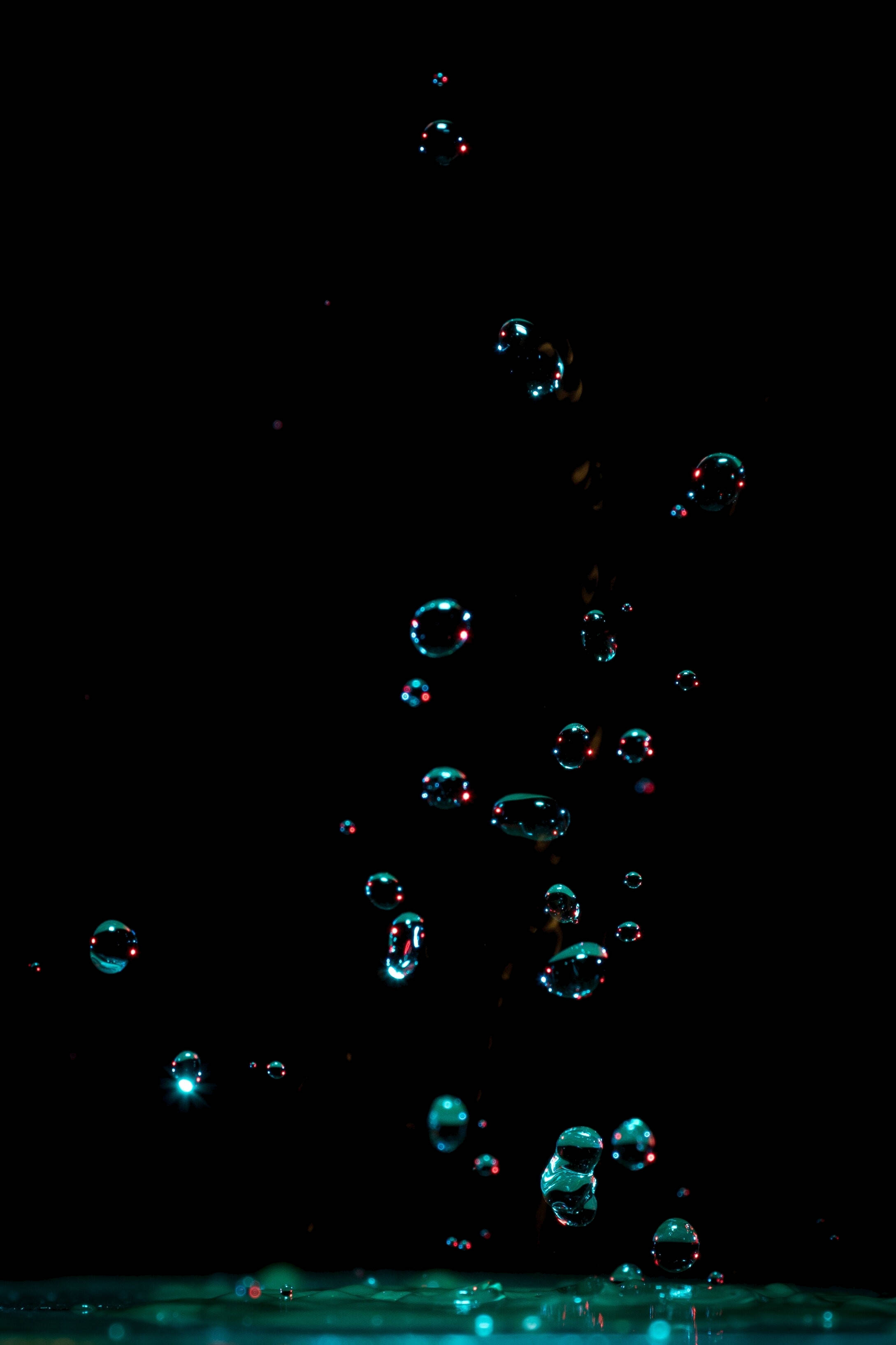 iPhone 11 Pro Max, water droplets, pitch-black background, 2K Phone Wallpaper