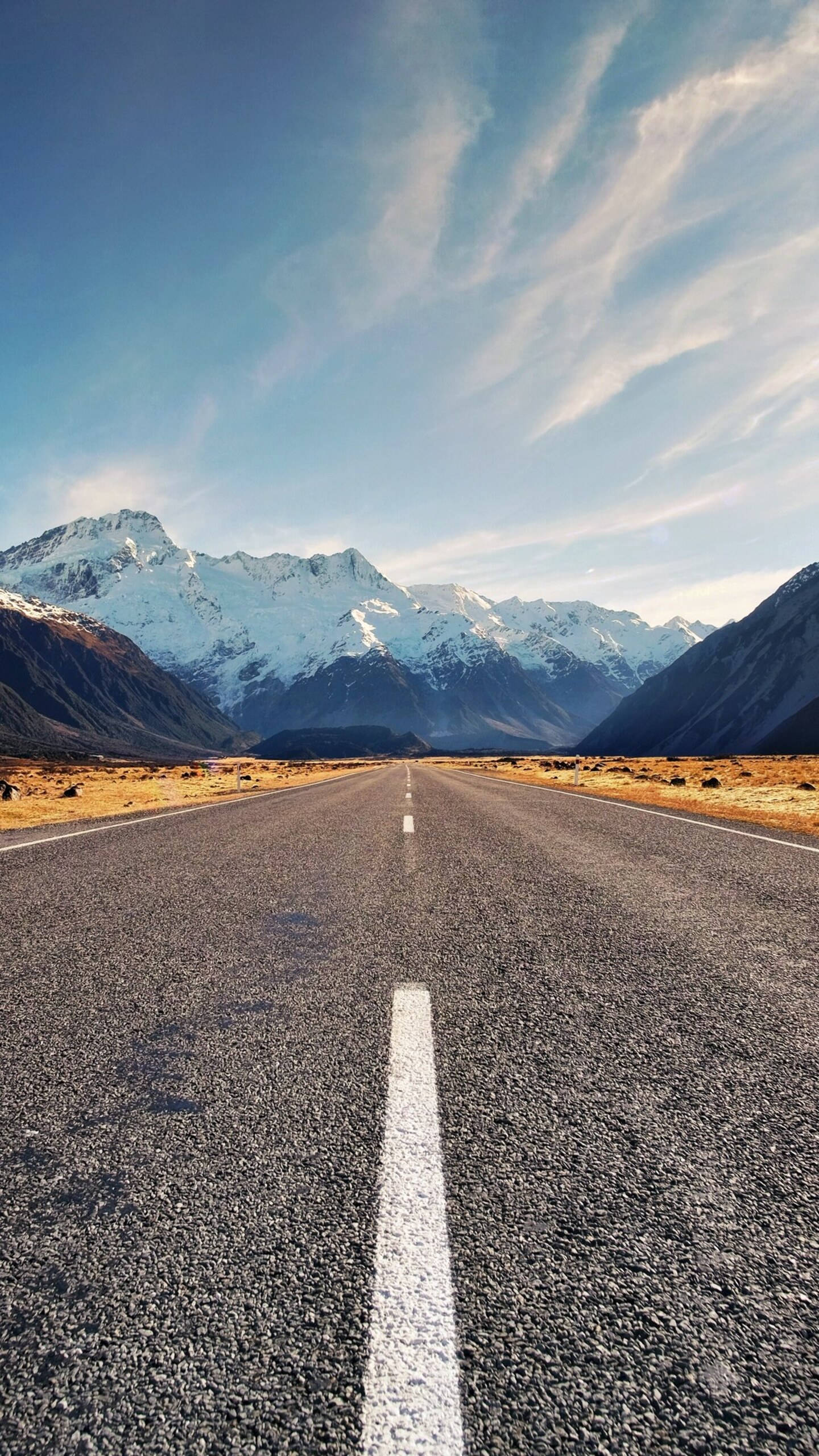 iPhone 12 Pro Max, asphalt road, snow-capped mountains, 2K Phone Wallpaper