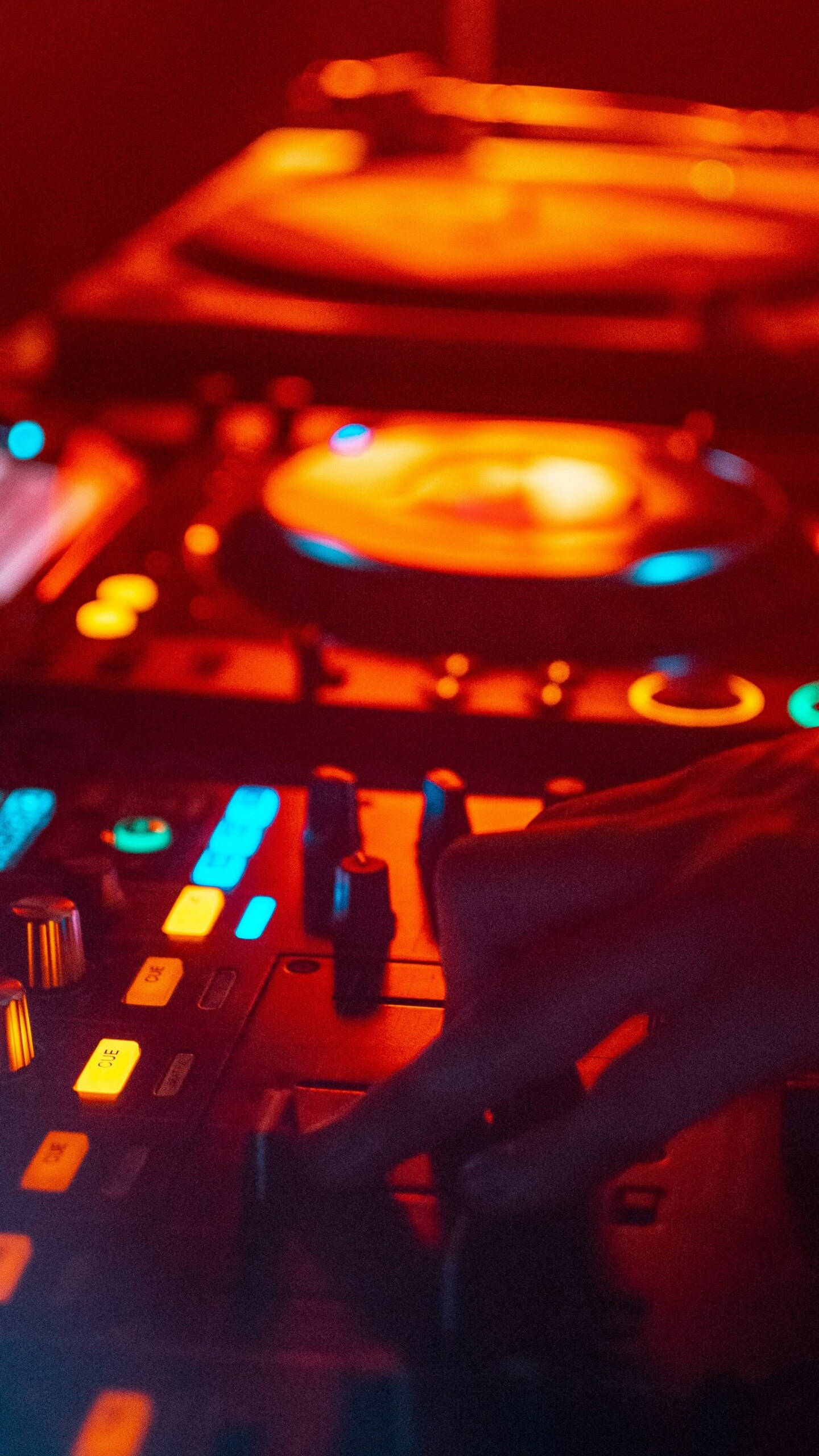 iPhone 12 Pro Max, glowing DJ controller, warm red neon lights, 2K Phone Wallpaper