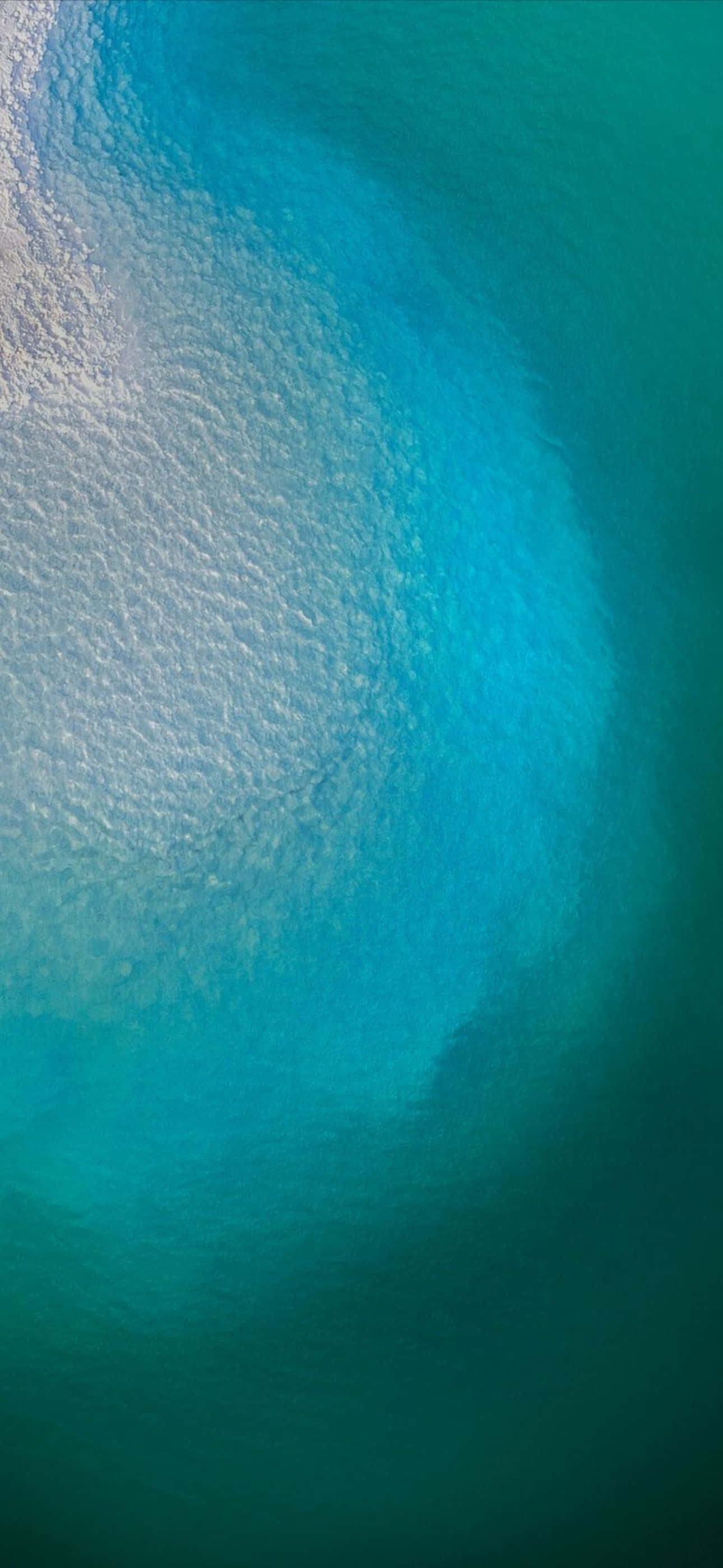 iPhone 14 Pro Max, turquoise ocean water, foamy white waves, 2K Phone Wallpaper