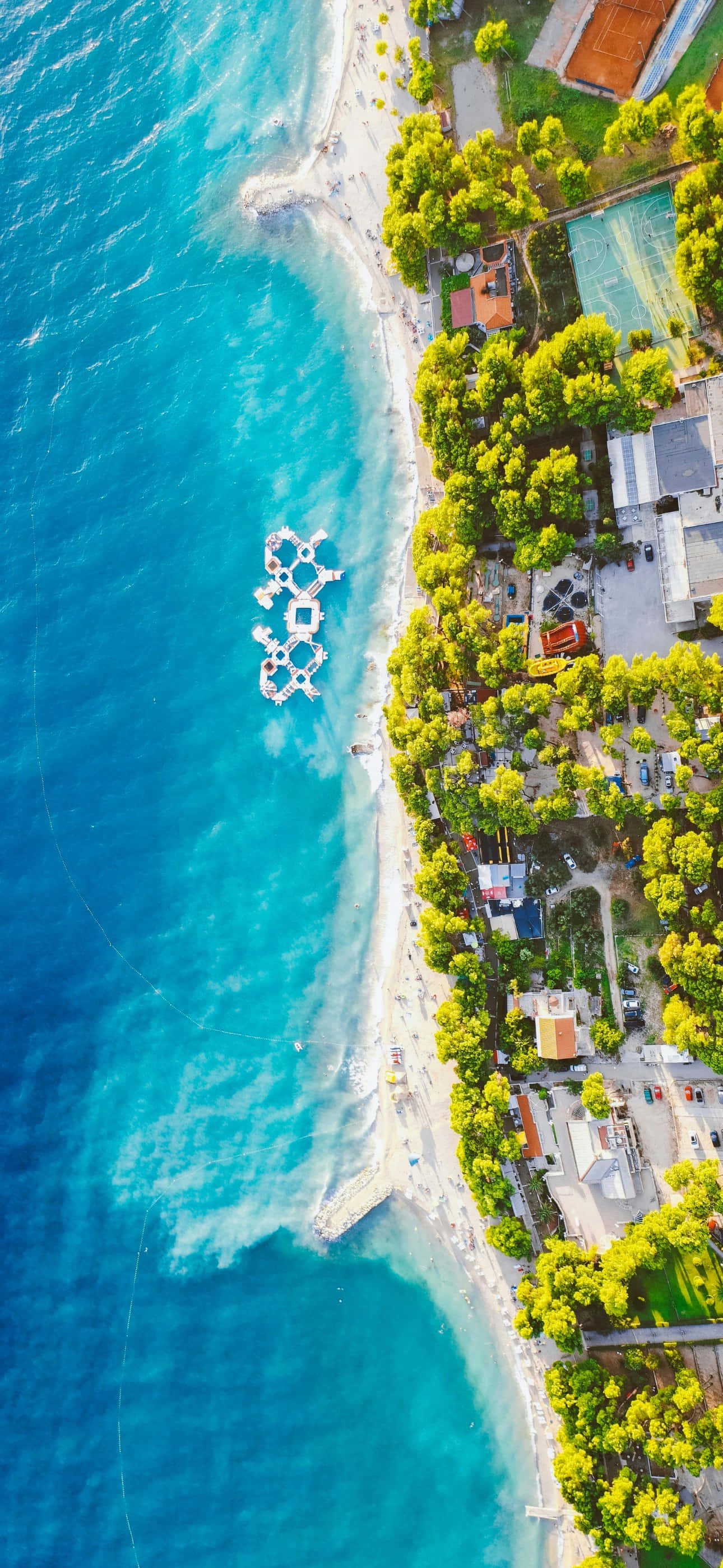 iPhone 16 Plus, turquoise sea, sandy beach, 2K Phone Wallpaper