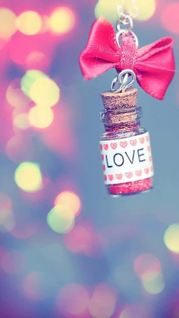 iPhone 5c, glittery love potion bottle charm, pink bow, SD Phone Wallpaper