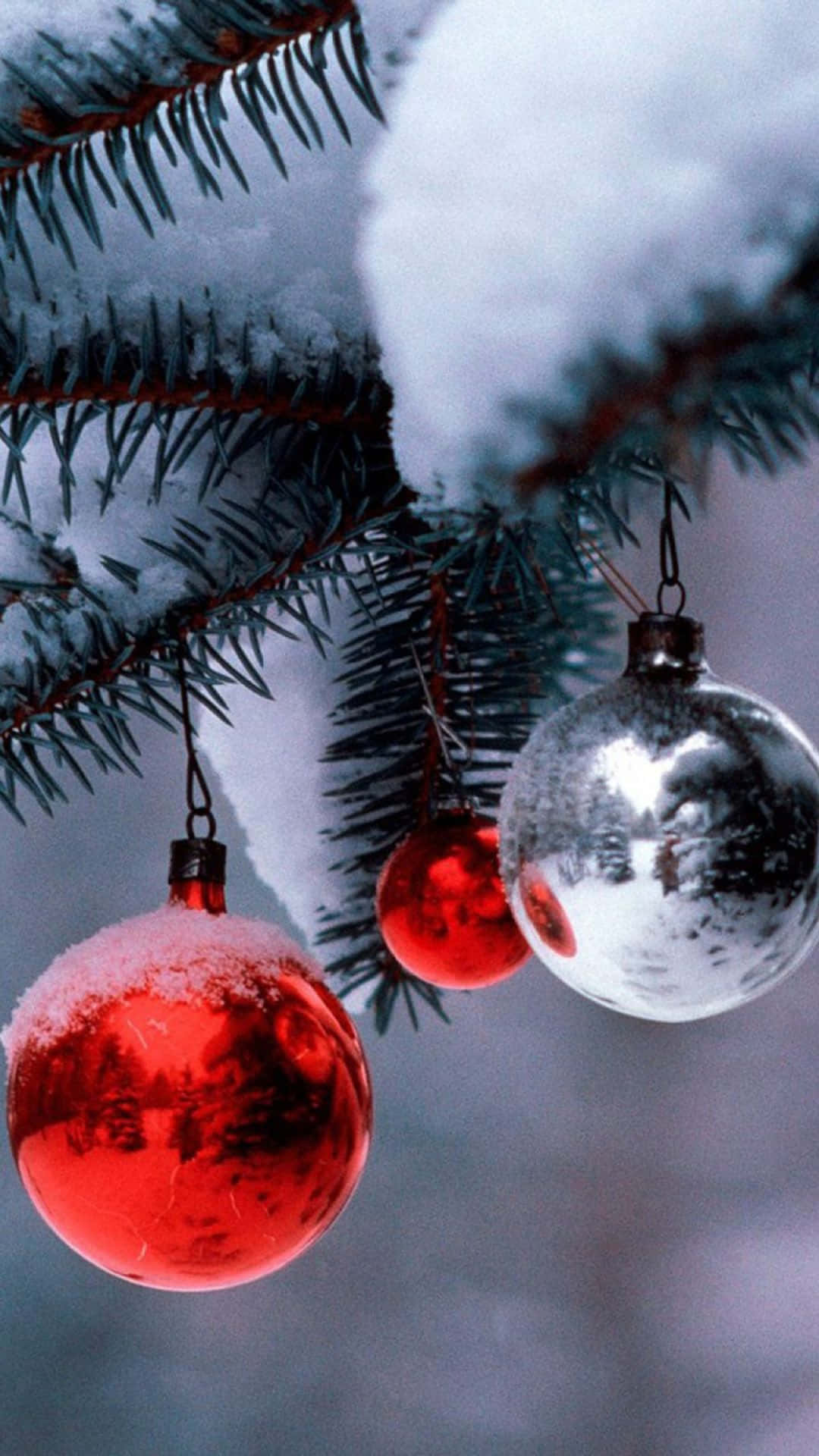 iPhone Christmas Snow, red and silver Christmas ornaments, snow dusts pine branches, Full HD Phone Wallpaper