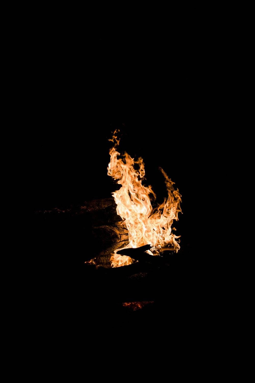Burning Fire Oled iPhone, vibrant fire, pitch black background, HD Phone Wallpaper