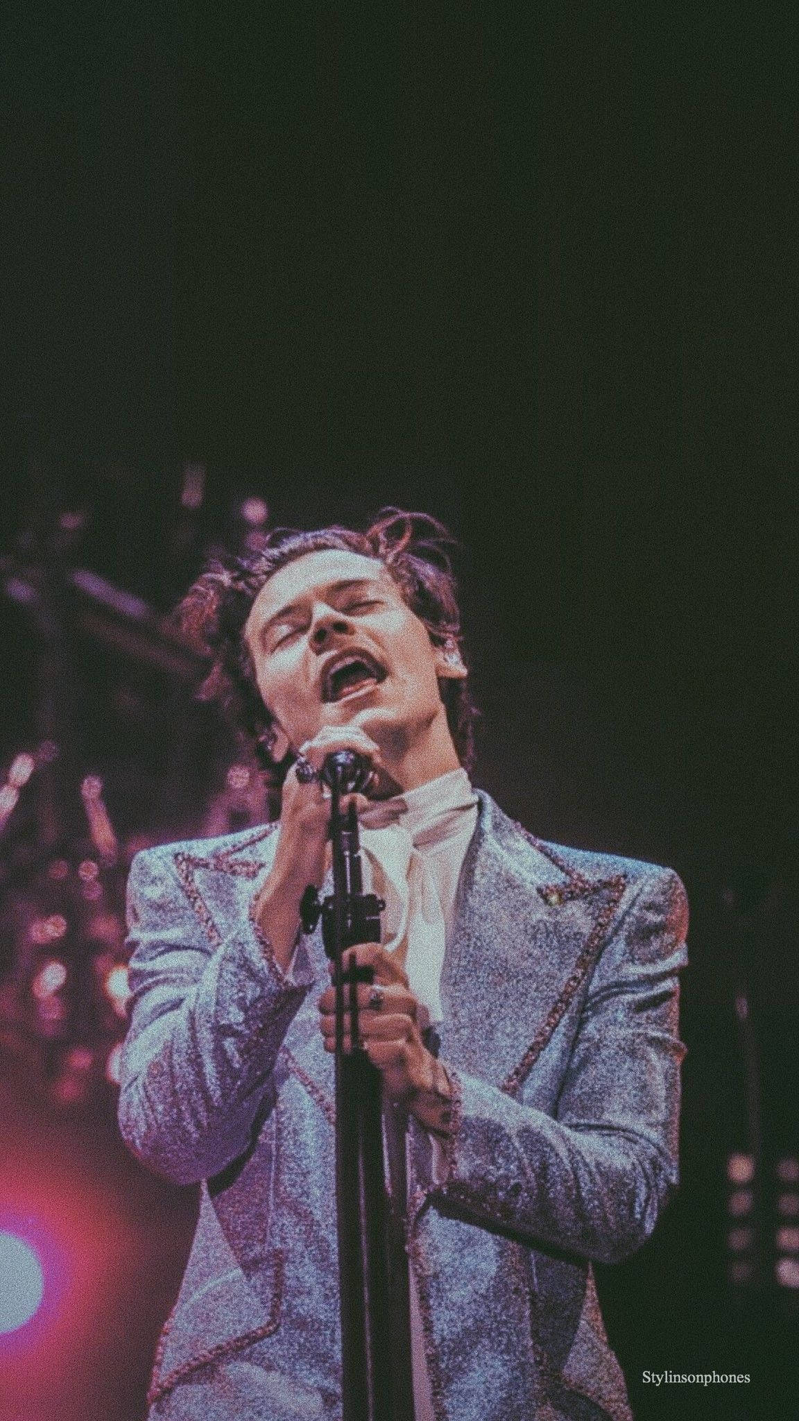 Harry Styles, glittering silver suit, vibrant stage lights, Full HD Phone Wallpaper