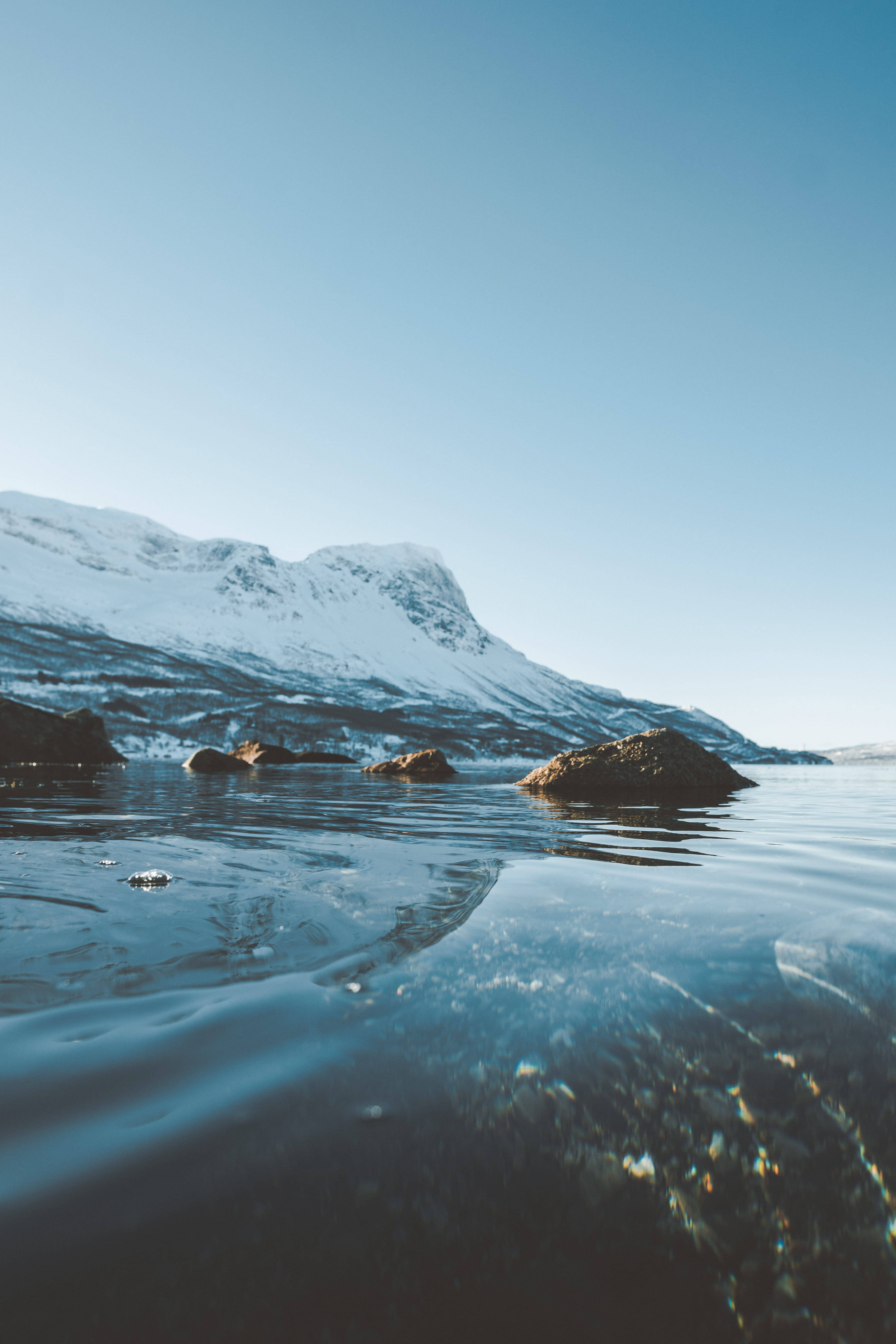 snowy mountain, calm waters, rocks, 5K Phone Wallpaper