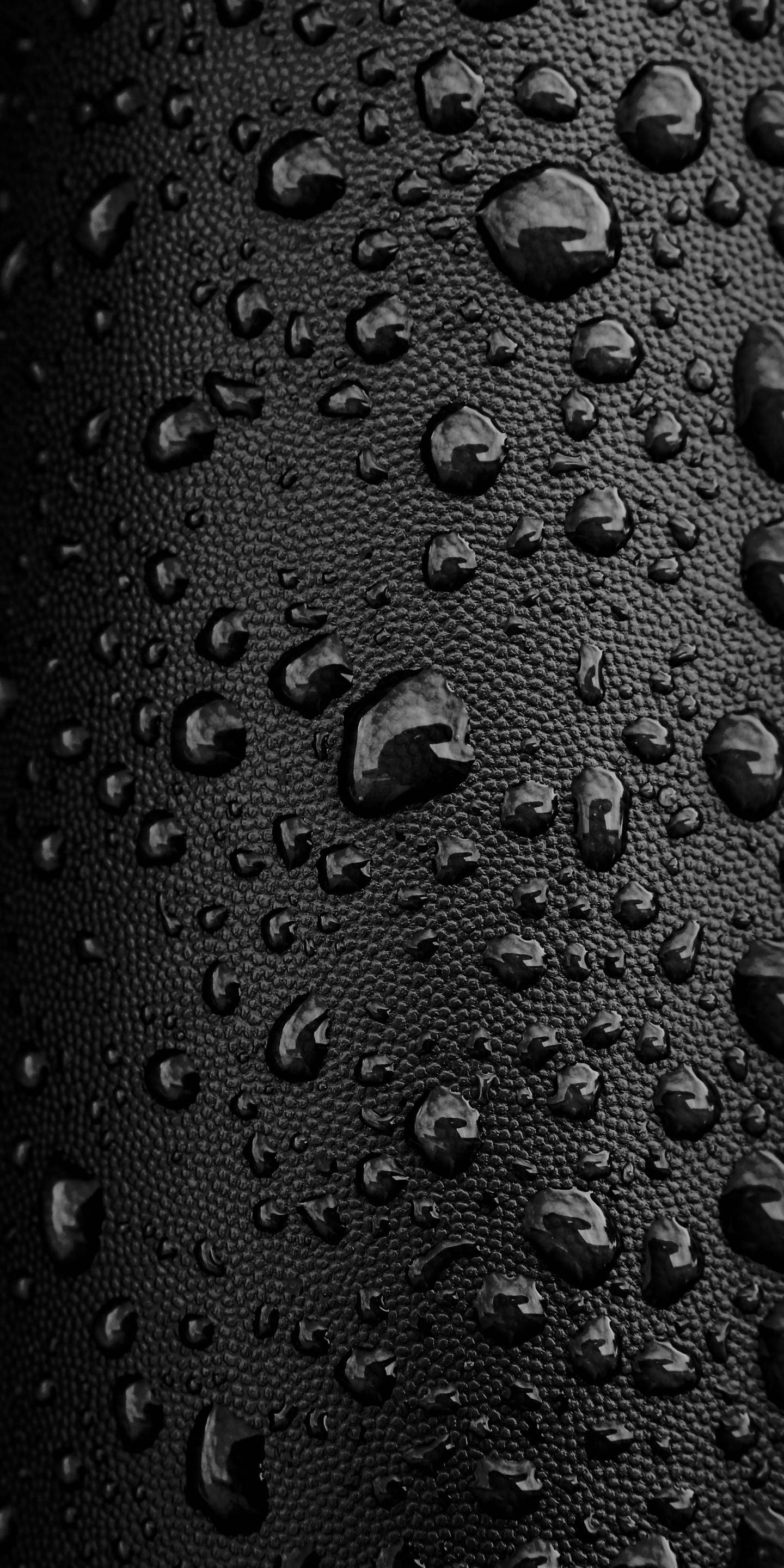 iPhone Rain, water drops, black leather surface, 2K Phone Wallpaper