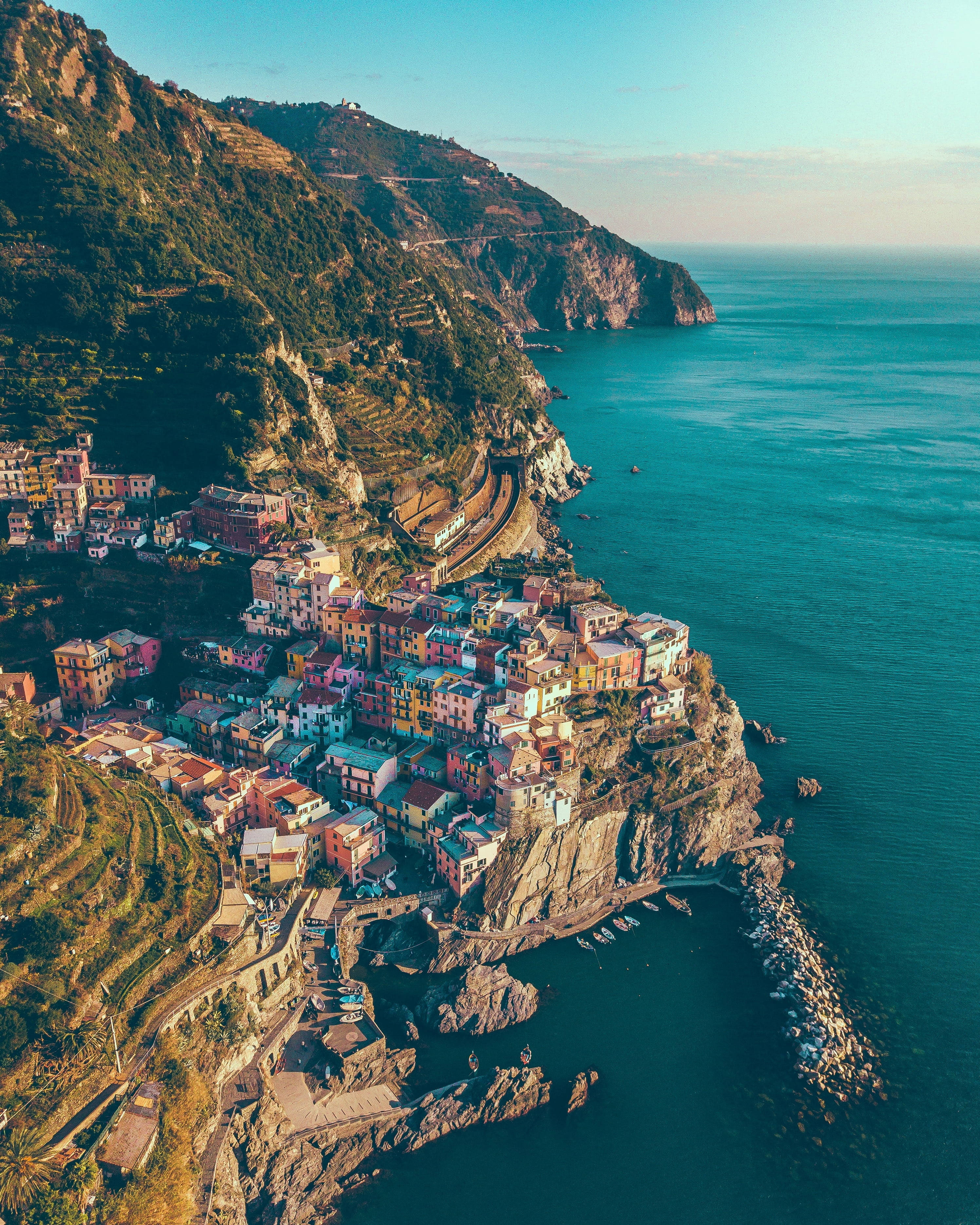cliffside village, rugged coastline, turquoise sea, 2K Phone Wallpaper