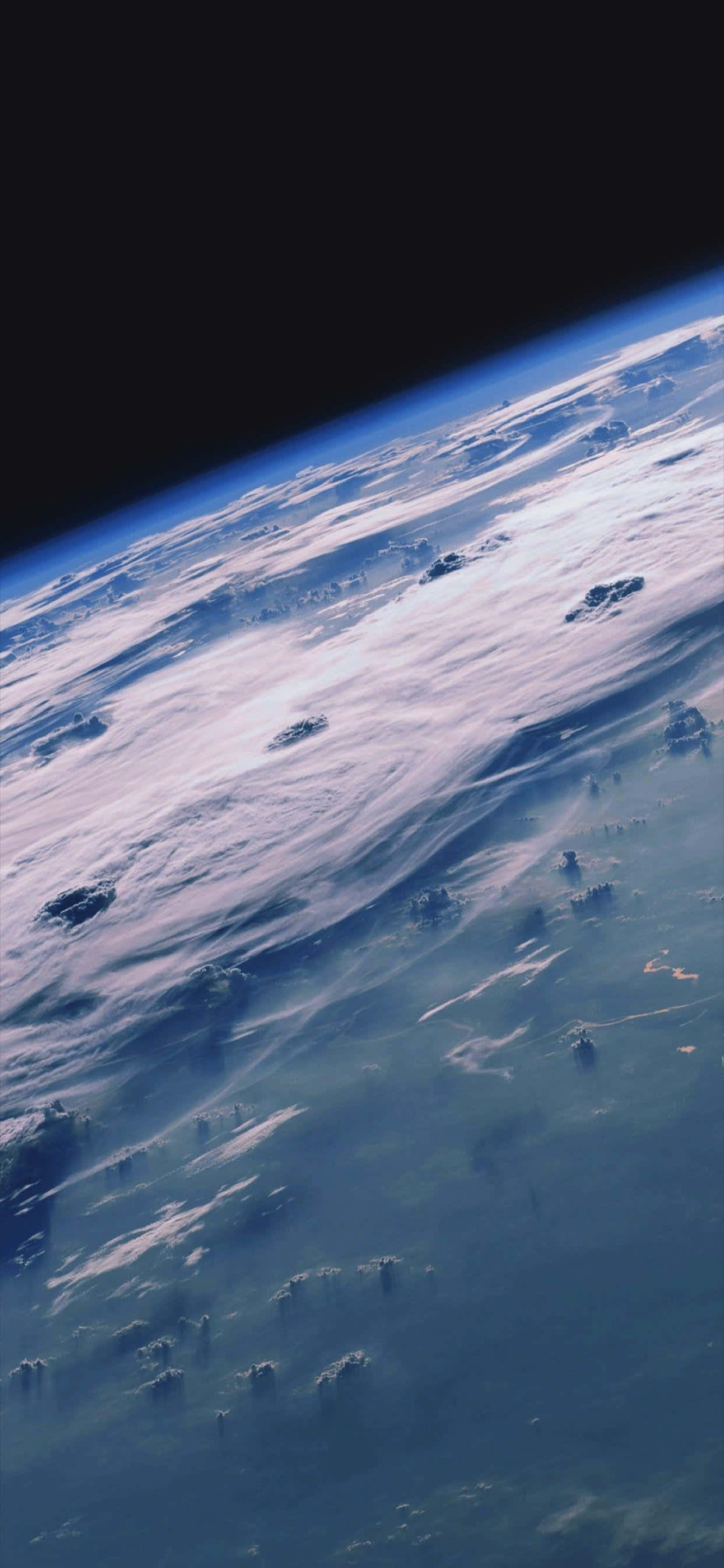 iPhone X, Earth, swirling clouds, 2K Phone Wallpaper
