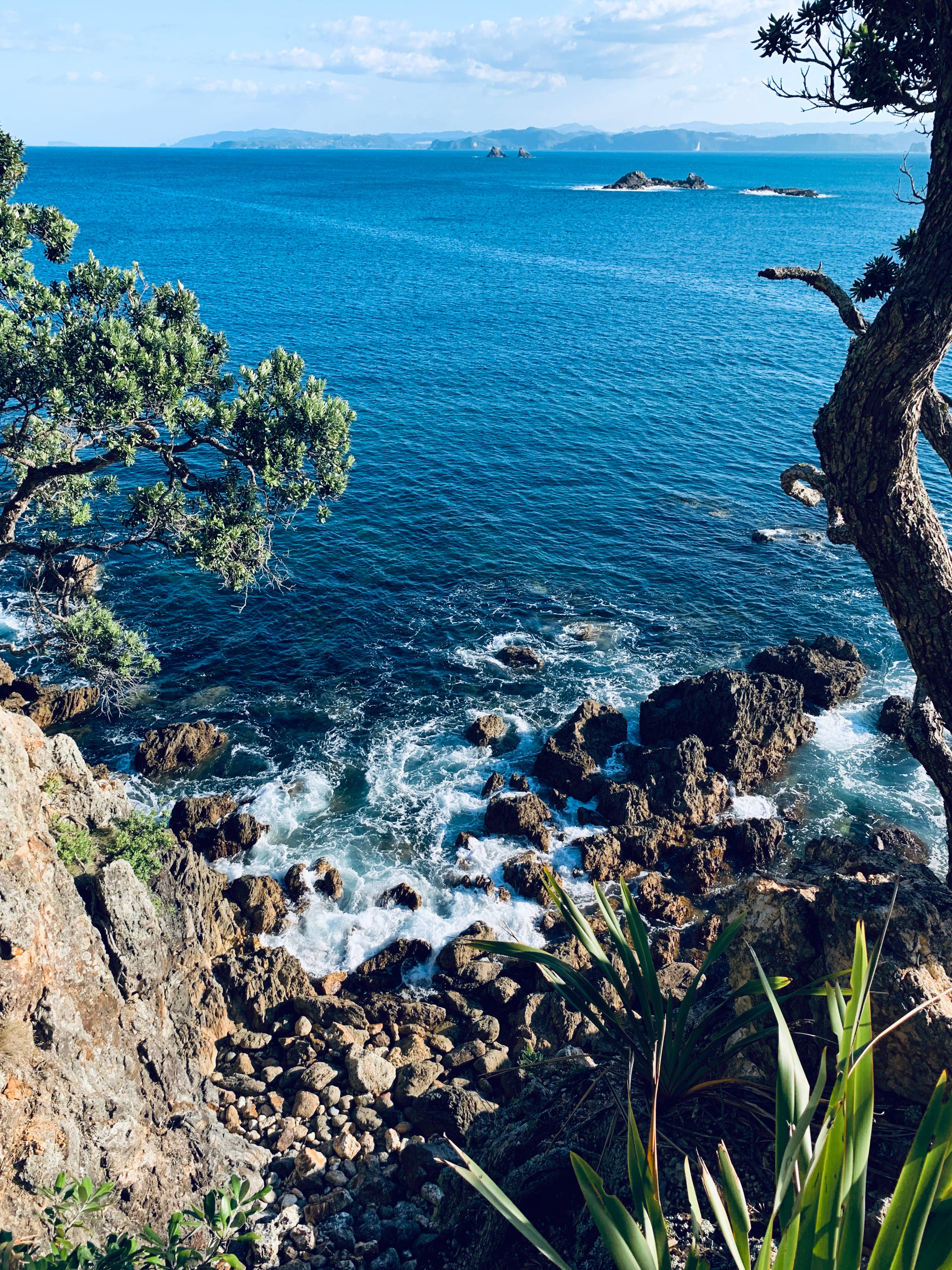 iPhone Xs, vibrant blue ocean, rugged cliffs, 4K Phone Wallpaper
