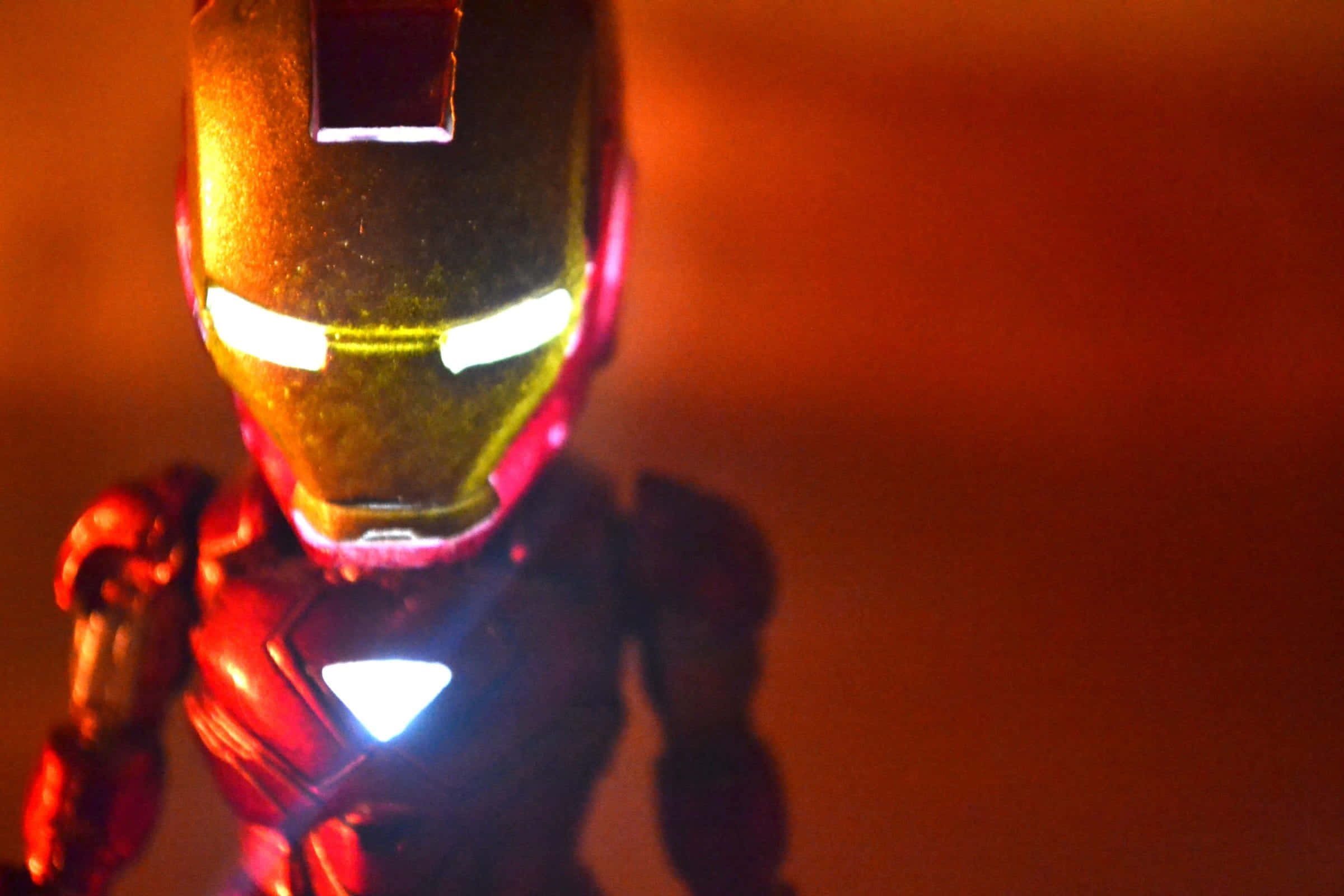 Iron Man action figure, glowing eyes, chest arc reactor, Full HD Desktop Wallpaper