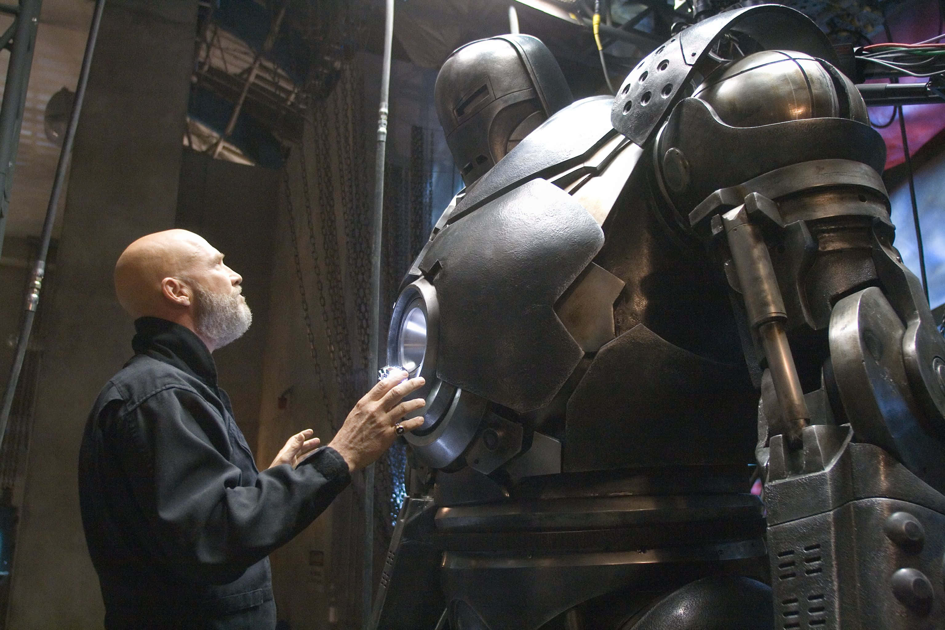 Iron Monger, glowing chest, towering metallic robot, 2K Desktop Wallpaper