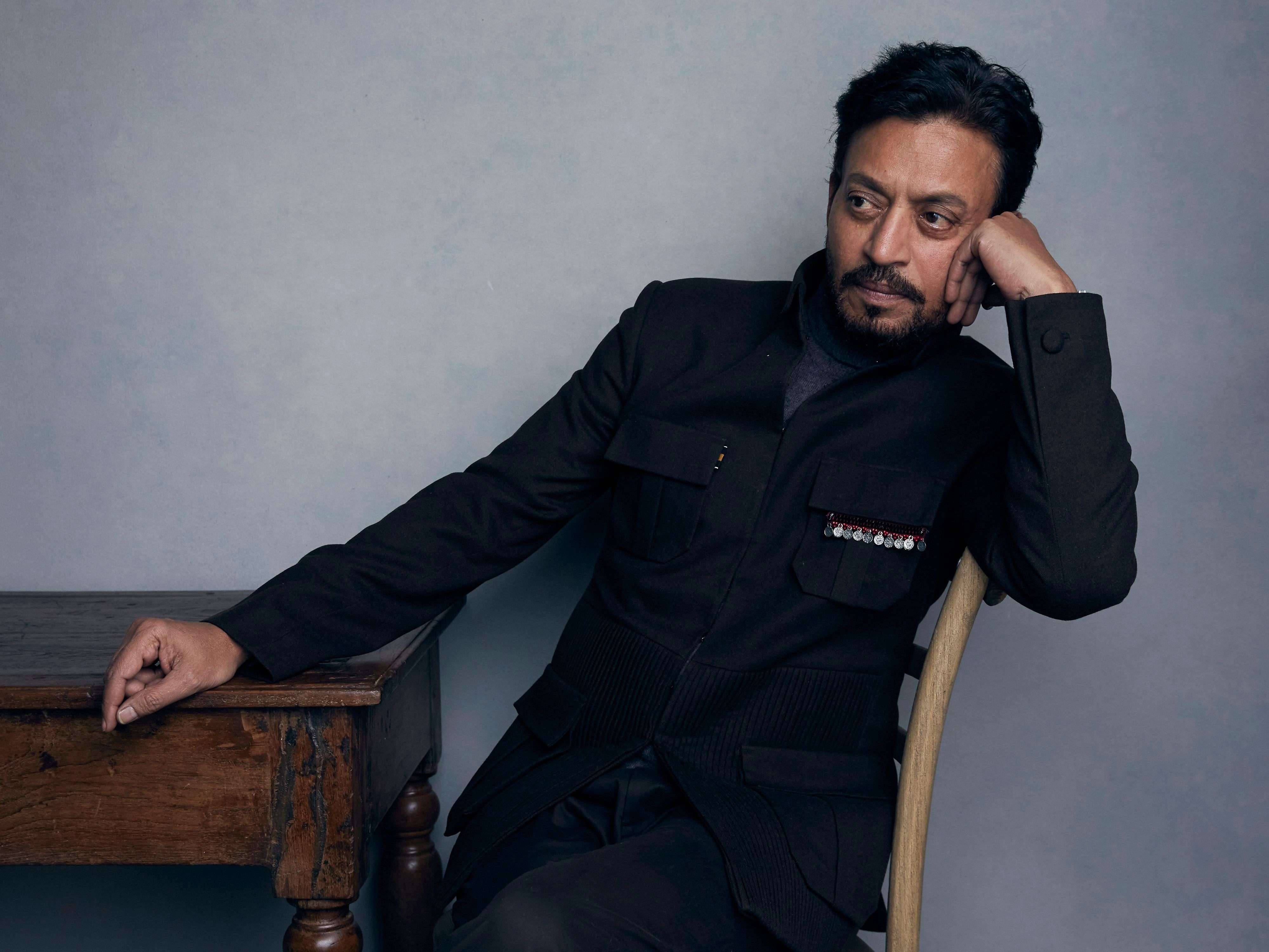 Irrfan Khan, dark tailored jacket, rustic wooden table, 4K Desktop Wallpaper