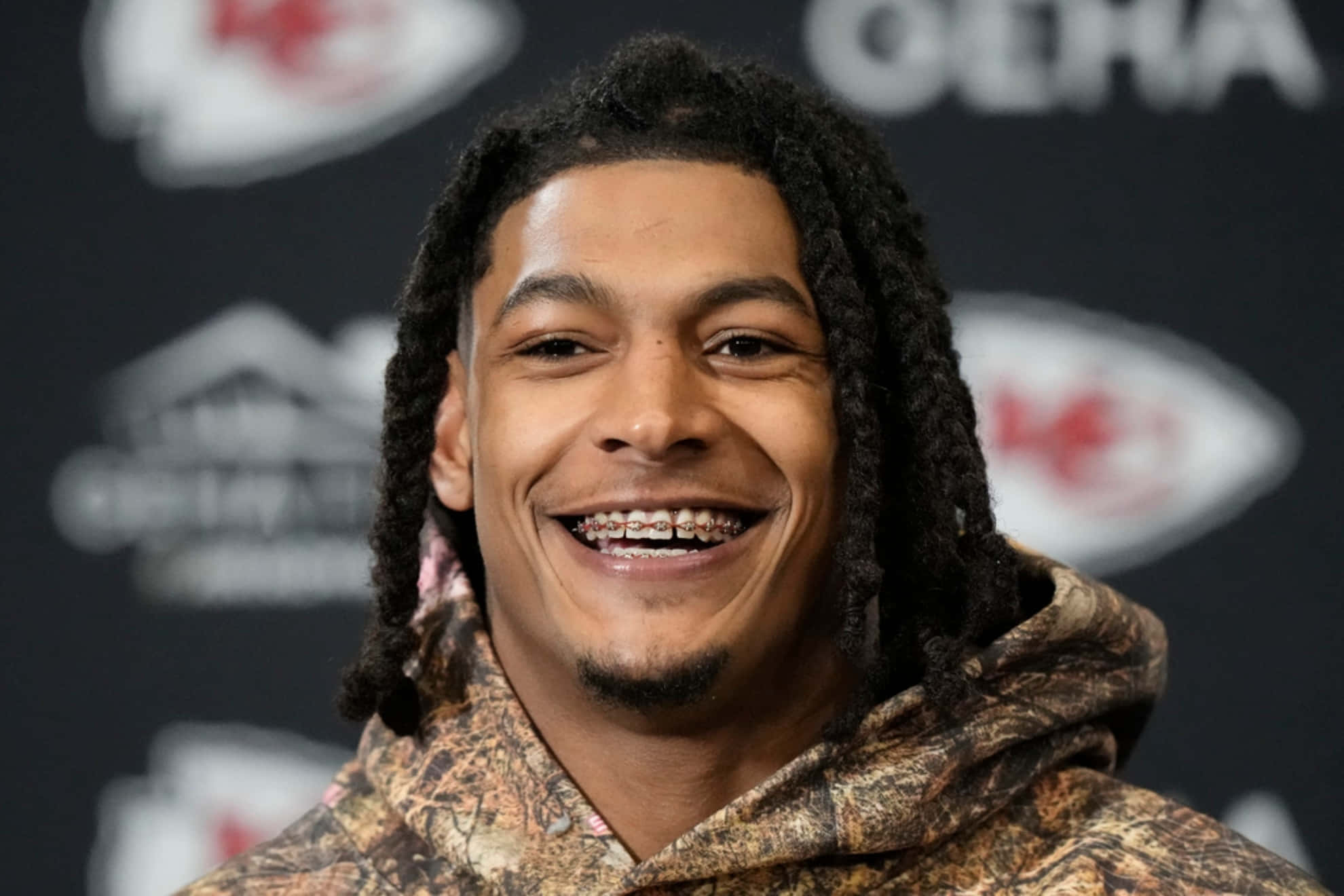 Isiah Pacheco, smiling, camouflage hoodie, Full HD Desktop Wallpaper