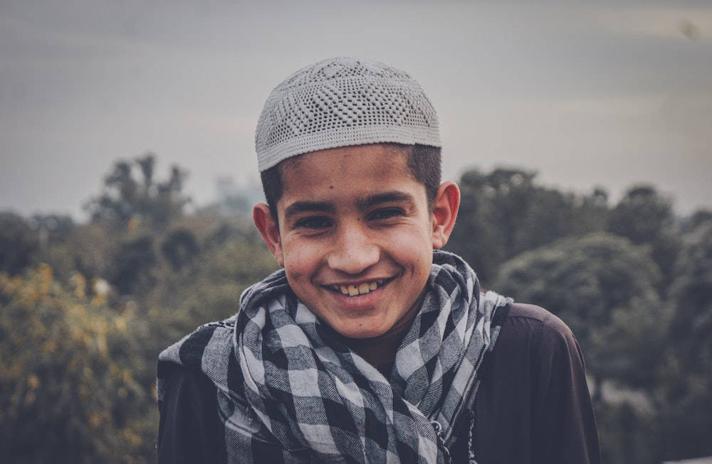 Islamic Boy, white knitted cap, plaid scarf, SD Desktop Wallpaper
