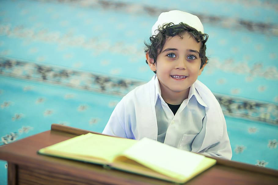 Islamic Boy, white traditional attire, wooden desk, SD Desktop Wallpaper