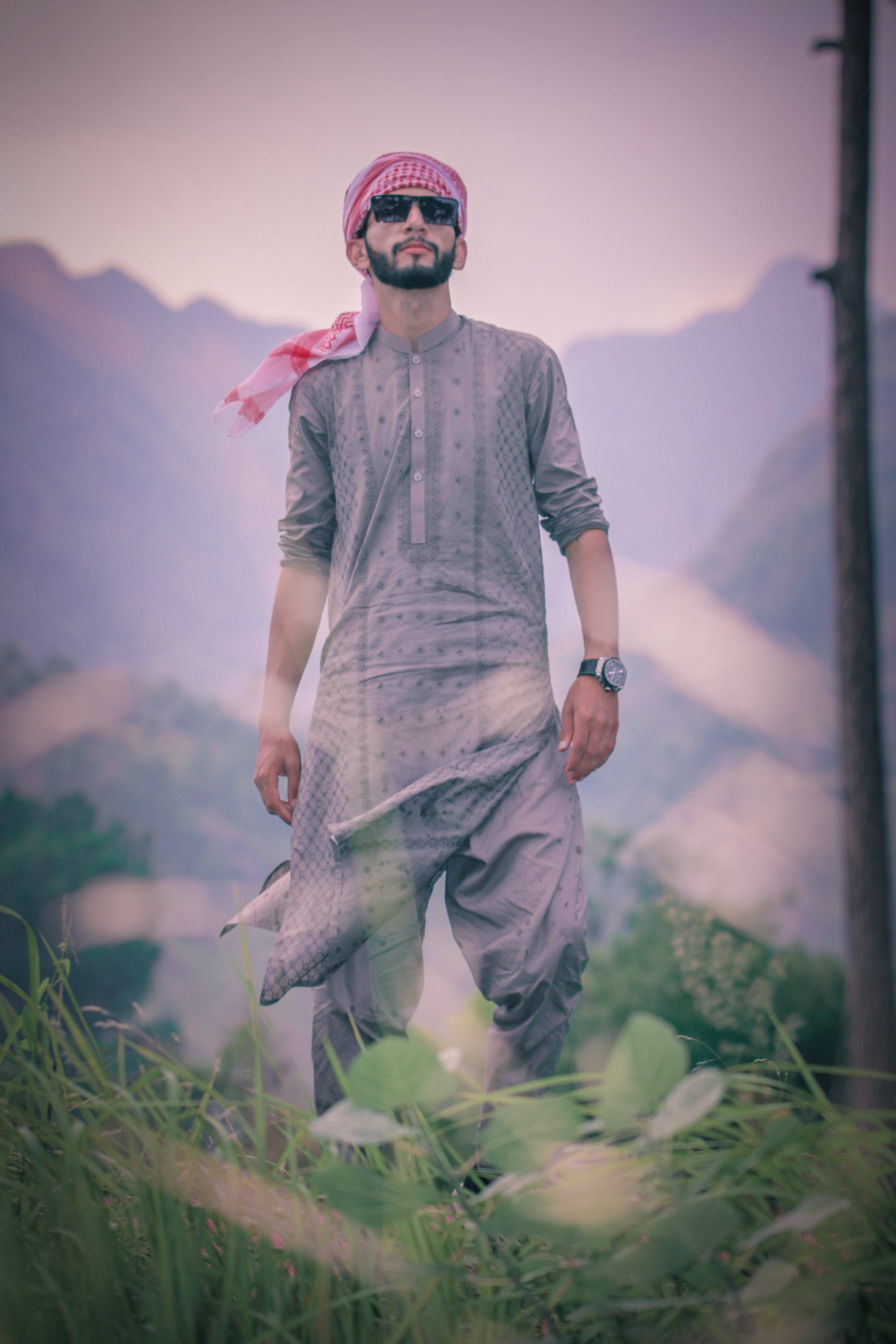 Islamic Boy, gray kurta, grassy hillside, 5K Phone Wallpaper