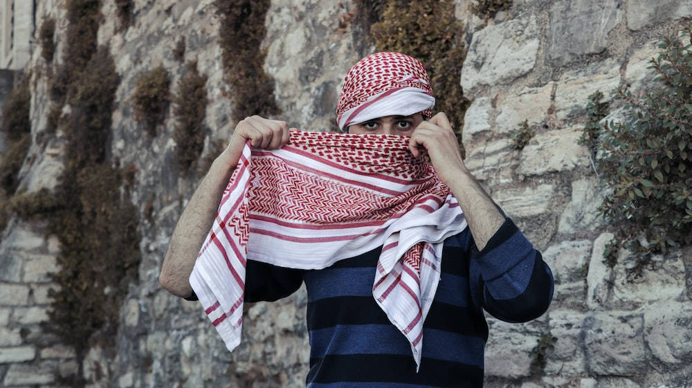 Islamic Boy, red and white patterned keffiyeh, striped shirt, SD Desktop Wallpaper