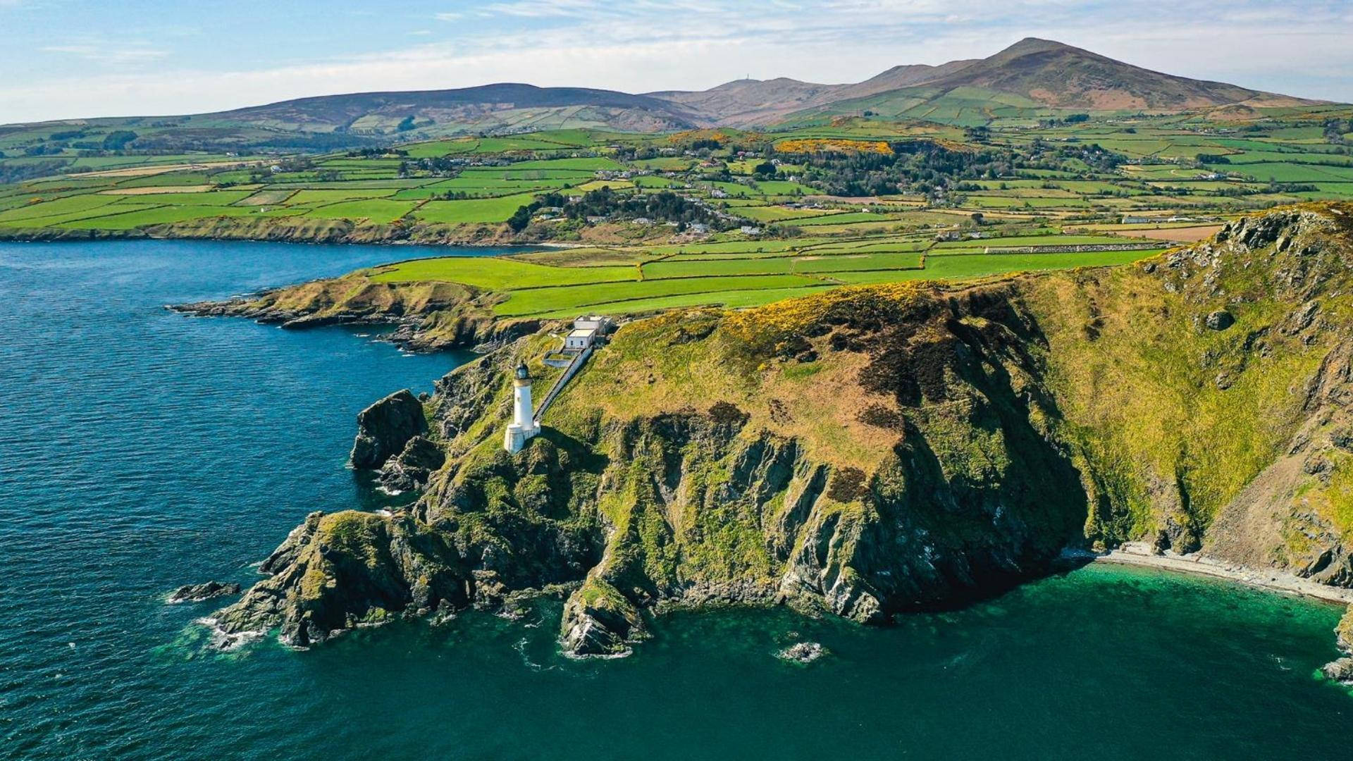 Isle of Man, white lighthouse, rugged green cliff, Full HD Desktop Wallpaper