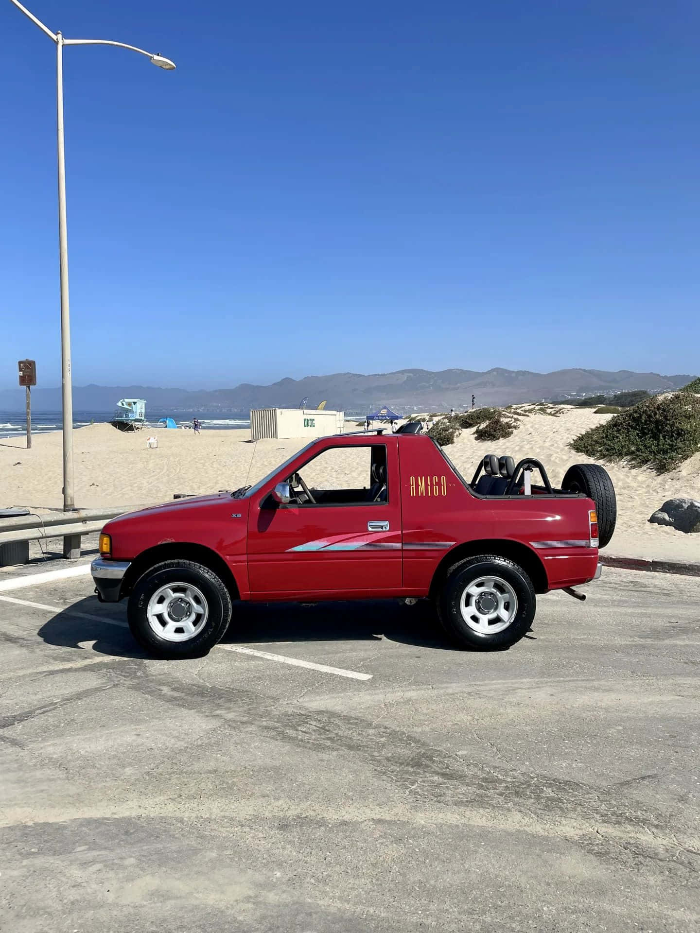 Red Isuzu Amigo, beachside parking, sandy beach, Full HD Phone Wallpaper