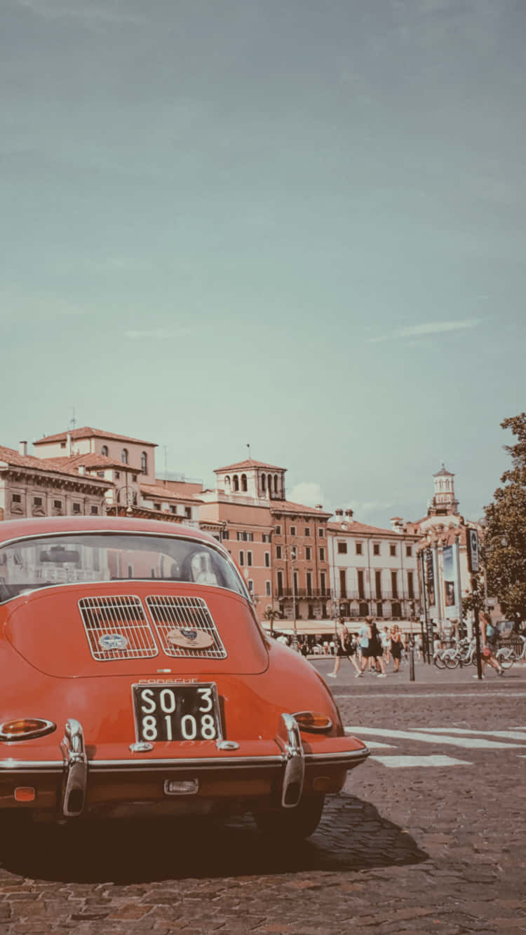 vintage red Porsche 356, cobblestone street, historic European buildings, HD Phone Wallpaper